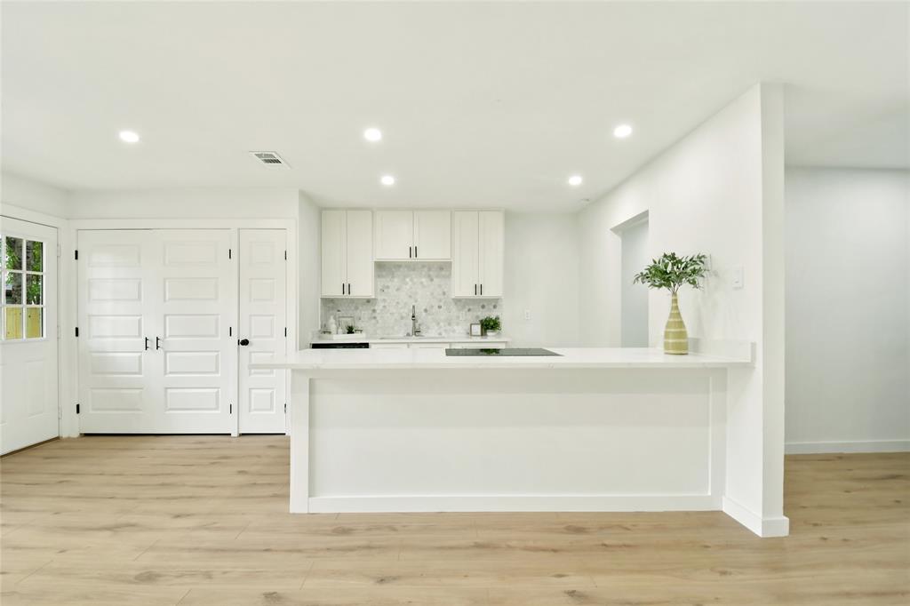 Beautifully renovated home in the heart of Allen! This move-in ready gem features a brand-new 3-ton HVAC system & furnace (10 year warranty), ALL new ductwork, roof (2025), electrical panel, and hot water heater. ** Enjoy the raised ceilings which makes this home look and FEEL much BIGGER  ** NEW German-made luxury vinyl flooring through-out * Kitchen: New custom 42” kitchen cabinets, quartz countertops, designer backsplash, and NEW stainless appliances. ** Both bathrooms are fully updated with New Cabinets & Countertops, toilets, tiled showers & flooring, and new fixtures. *Freshly painted interior & exterior, custom doors with matching hardware, tons of New recessed LED lighting, and all-new fans.** Finished garage, NEW fence, and spacious yard with mature trees. Open floor plan feels bright, airy, and much larger than expected — truly a must-see modern home! **SEE FEATURE SHEET FOR ALL RENOVATIONS