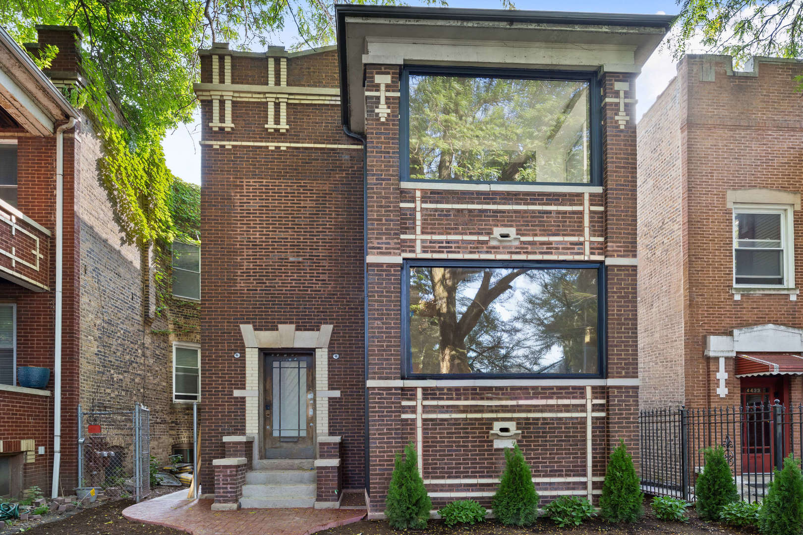 This classic brick residence has been thoughtfully transformed from a multi-unit into a spacious 5-bedroom, 3.5-bath single-family home that perfectly blends historic charm with modern updates. Sitting on an extra-wide 30ft lot and tucked on a tree-lined street, this home offers an inviting layout and stylish finishes throughout. Inside, tall ceilings and gleaming clear white oak hardwood floors create a bright, open feel. The main level flows seamlessly from the living and sitting rooms to a generous dining space and a luxury kitchen with Thermador appliances, a large island, breakfast nook, and easy access to the back deck - ideal for entertaining. A powder room and mudroom add convenience on this level. Upstairs, there is a spacious primary bedroom with an additional seating area, expansive walk-in closet, and a spa-like bath with a soaking tub, dual shower heads, and heated floors. Two additional bedrooms - each with walk-in closets - share a full bath, while a full-size laundry room adds everyday ease. The finished basement offers even more living space, complete with an additional bedroom, full bath, office, recreation area, additional laundry, and abundant storage. Also enjoy an oversized garage. Steps from Horner Park, local restaurants, and all the neighborhood favorites, this home also offers easy access to public transportation and expressways. Don't miss the opportunity to own a move-in-ready home in the Bateman School District that combines timeless character with modern convenience.