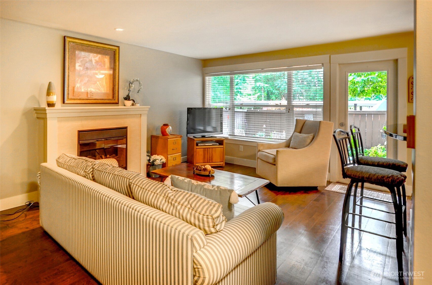 Fantastic location! Step inside to discover a thoughtfully designed space that blends indoor/outdoor living. Fully updated Ground Level unit with fully fenced patio and garden area, lrg enough for furniture + BBQ. Well kept, featuring hardwood floors, stainless appliances, fireplace, living room for easy entertaining. Lrg bedroom & nice size upgrades include new roof, new electrical panel & common area carpet/paint. Invite your friends & cool off in Club House pool on hot days! Inside, natural light pours through windows, illuminating open-concept flr plan & highlighting quality finishes. The kitchen is functional/elegant. Ample closet space & an in-unit laundry.Covered parking The tranquil garden views offers peaceful retreat!