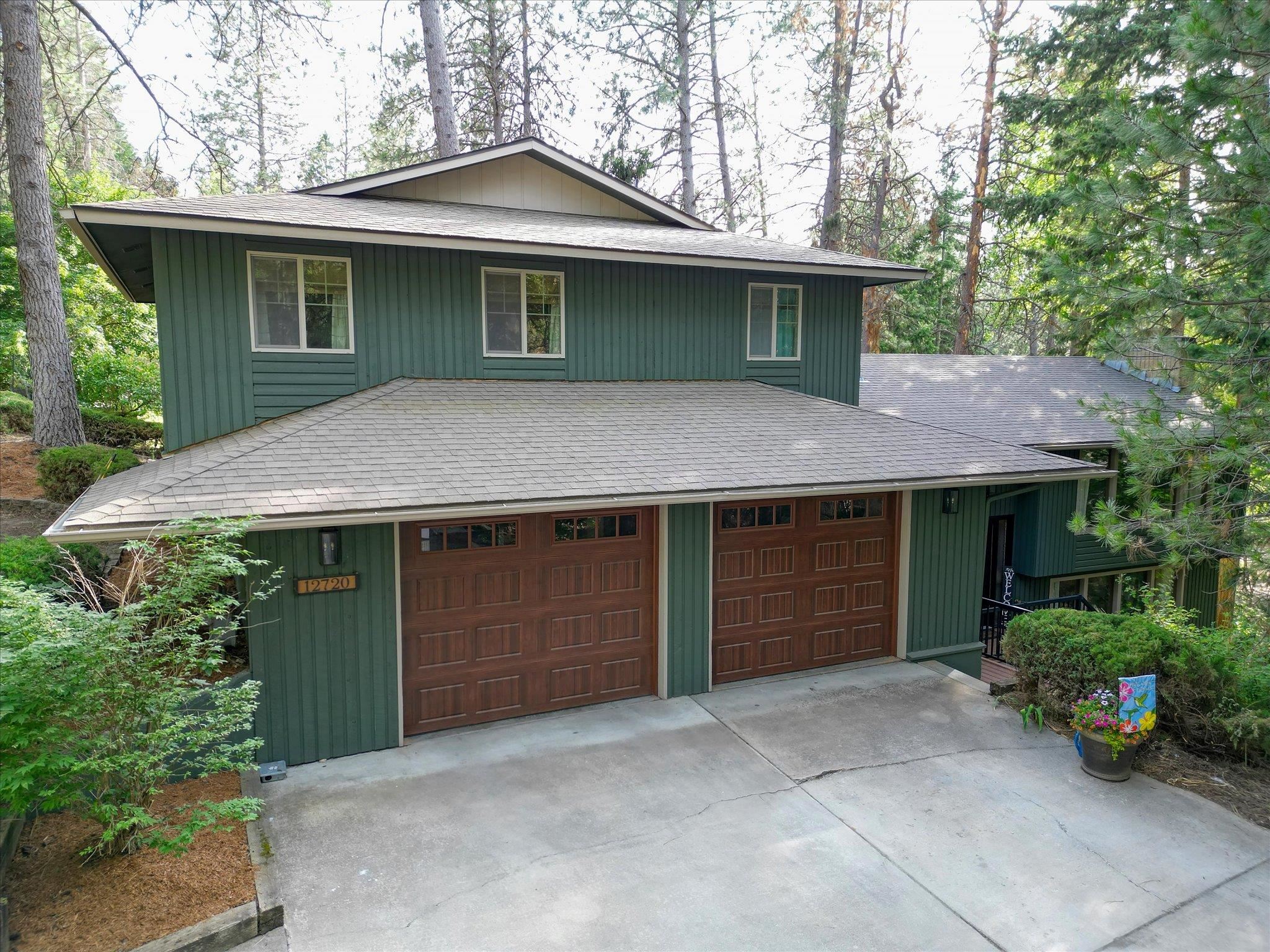 Amazing South Valley home on Half Acre Lot! Come see this stunning, secluded Painted Hills home featuring 4 bedrooms plus den & 4 bathrooms. The updated kitchen will not disappoint with quartz countertops, full tile backsplash, stainless appliances, eating bar and the biggest pantry ever. Brand new carpet upstairs in the 3 bedrooms which includes the Primary Suite with walk in closet & brand new bathroom with a full tile walk in shower, double sinks & all updated fixtures. 2 family rooms with fireplaces. Every bathroom has been updated as well as new windows, new deck, fresh paint inside and out and new garage doors. 4th bedroom/In Law set up in basement with separate driveway and entrance and its own patio. Privacy abounds in this Painted Hills beauty. Don't miss this one!!