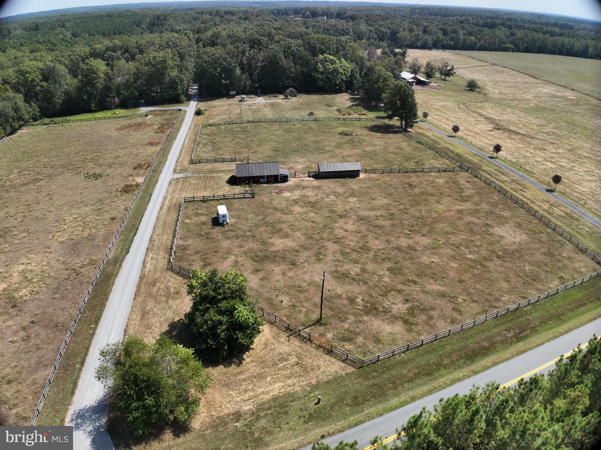 New Price!! 7+ Acres with $100,000+ in improvements -  Incredible value at this price! Build your dream home on this gorgeous 7+ acre farmette with NO HOA - the heavy lifting has already been done! Electric is already on site in addition to a private well and a 3 bedroom conventional septic system installed approximately 2018. Currently used as a horse farm, this property features a custom built barn with a separate run-in barn for additional stalls or storage with wood fencing around several acres for plenty of livestock space. The cottage has electric baseboard heat and running water, as well as a full bathroom. Beyond the cottage is another custom built building, a 3-bay garage with additional dry storage wings/bays on each end. All buildings were built approximately 2018. Convenient to Orange ,Fredericksburg and Charlottesville commutes! Reach out to your favorite Realtor to tour today! Measurements and lot lines are approximate.