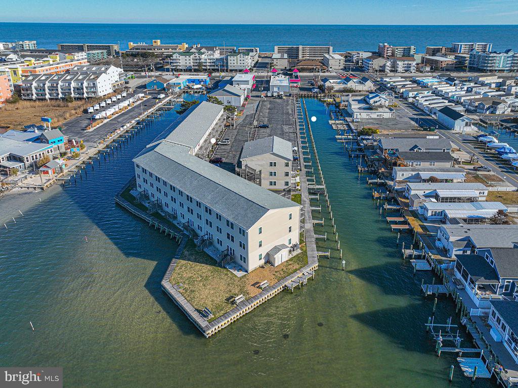 Welcome to your slice of coastal living in Ocean City, Maryland. This beautifully designed 2-bedroom, 2-full-bath residence offers a spacious, open kitchen and living area perfect for entertaining or unwinding after a day on the water. A separate laundry room adds everyday convenience, while the bonus living space with bay views creates the ideal spot for morning coffee or sunset cocktails.One of the true highlights? Your deeded boat slip just steps from the unit. Walk out to your boat and be cruising the open bay in moments, no trailering, no hassle, just effortless waterfront living.Whether you’re searching for a primary residence, second home, or income-producing investment, this property checks every box. Located just two blocks from the beach and within walking distance to restaurants, shopping, family fun, and Ocean City’s legendary nightlife including **Seacrets, Macky’s Bayside Bar & Grill, and Fager’s Island you’ll be right in the heart of it all.Boating. Beaches. Dining. Entertainment. Lifestyle.What are you waiting for? Schedule your private showing today and start living the Ocean City dream!