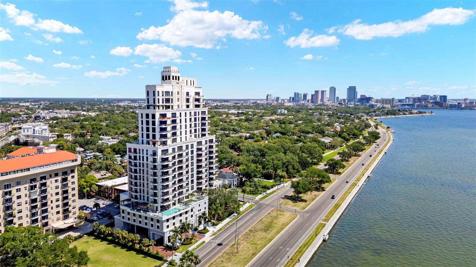 Discover an exceptional new standard of living at Hyde Park House, an elegant 22-story residential tower offering just 70 exclusive residences along iconic Bayshore Boulevard. Perfectly positioned in the heart of historic Hyde Park, The Chester residence spans over 2,000 square feet and is thoughtfully designed for both comfort and privacy. This split-bedroom floorplan comes furnished, minus personal items, and features two spacious bedrooms, a versatile den, and three full bathrooms. The den is appointed with a built-in wall bed that effortlessly converts to a desk, making it ideal as either a guest room or a private home office. An oversized terrace extends your living space outdoors, with access from both the Great Room and Owner's Suite — ideal for enjoying the tree tops of Hyde Park. Interiors showcase high-end finishes throughout, including 10-foot ceilings, expansive layouts, and large-format porcelain tile flooring. The chef-inspired kitchen is appointed with European-style cabinetry, quartz countertops, premium Gaggenau appliances, gas cooktops, and an Electrolux front-load washer and dryer. HunterDouglas electronic remote-controlled blinds included throughout. Furniture is negotiable. The building features a whole-building water softener system, a hot water supply system and a central cooling infrastructure designed for efficiency and comfort. The residence is served by the building's condenser water loop, which circulates chilled water throughout the tower. Your individual AC unit is powered by electric fans, meaning your electric bill will reflect energy used while your AC is running — a straightforward and transparent utility structure that puts cooling costs directly in your control. Residents enjoy a curated collection of resort-style amenities on a beautifully landscaped waterfront plaza, including a pool and spa, outdoor summer kitchen with gas grill, fire pit, fitness center, and social lounge. The building also offers a secure private parking garage, access-controlled entry, climate-controlled storage, and 24-hour front desk attendant. Tampa International Airport is just 20 minutes away. With its rare blend of modern luxury and walkable access to Hyde Park's renowned shopping, dining, and nightlife, Hyde Park House is one of South Tampa's most prestigious residential addresses.
