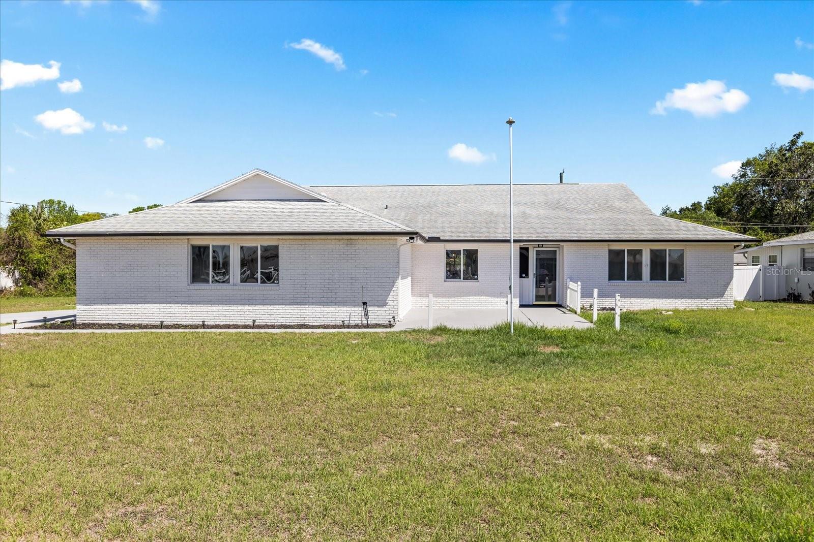One or more photo(s) has been virtually staged. Rare find in Deltona! Turn-key single-family home offering 1,986 sq ft of living space (2,119 total sq ft) on an oversized 0.46-acre lot. This 4-bedroom, 2.5-bathroom home features an open-concept layout ideal for modern living.Recent updates include new A/C, new water heater, new roof, new appliances, updated kitchen and bathrooms, new flooring, and fresh interior and exterior paint — making this home truly move-in ready.The expansive lot provides plenty of space for outdoor living, entertaining, or future additions.Seller offering $5,000 toward buyer’s closing costs. No HOA.Conveniently located near shopping, dining, and major roadways.