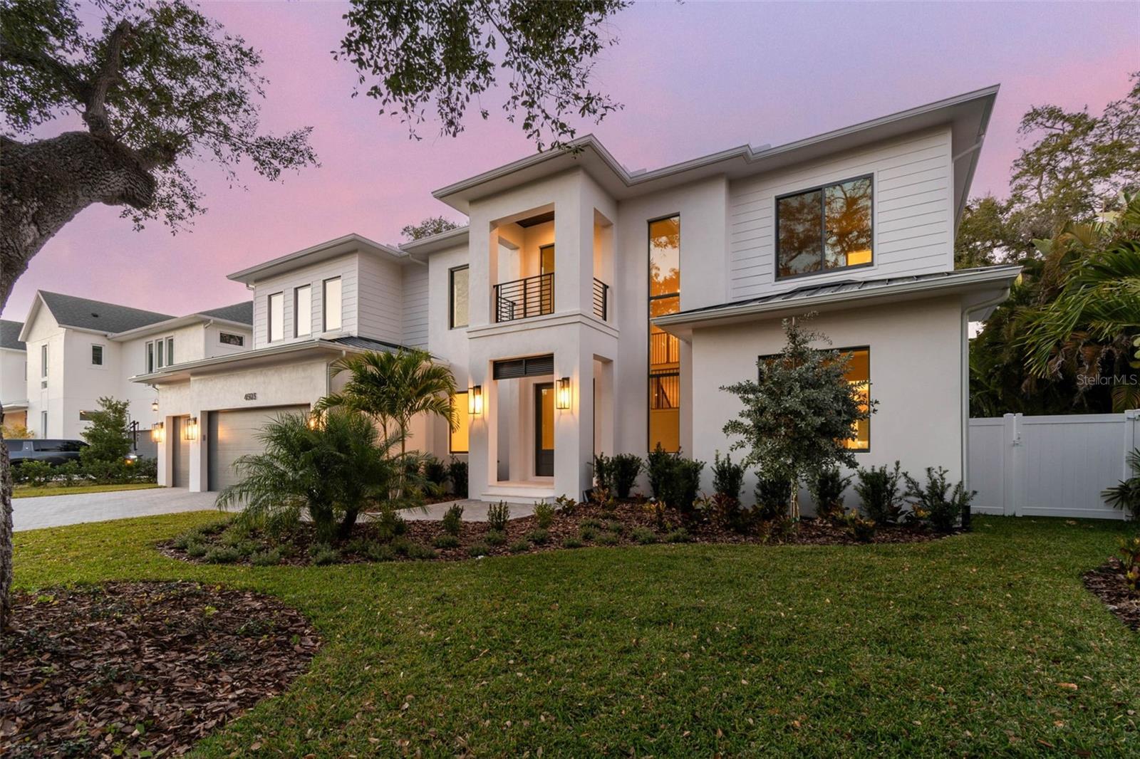 This gorgeous, newly completed new construction offers quality craftsmanship and immediate move-in readiness. Luxury and lifestyle converge on a rare 13,000+ square foot lot in the heart of Sunset Park—one of South Tampa’s most coveted neighborhoods. This two-story residence is thoughtfully designed for refined family living, offering 5 bedrooms, 5 full bathrooms, a powder bath, private office, formal dining room, media and game rooms, and dual laundry rooms. A dramatic 22-foot foyer sets the tone, opening to an expansive great room with coffered ceilings and a chef’s kitchen equipped with Thermador appliances, a waterfall-edge island, custom cabinetry, and a walk-in butler’s pantry. Built with quality, resilience, and comfort in mind, the home features impact-rated windows and doors for peace of mind, along with Icynene open-cell spray foam insulation in the attic and between floors for superior energy efficiency and sound dampening. The flexible floor plan includes a downstairs guest suite and media room, with sliding glass doors that lead to a resort-style backyard complete with a saltwater pool and spa, full outdoor kitchen, covered lanai, gas fireplace, and additional green space ideal for play or entertaining. Upstairs, you’ll find three en-suite bedrooms, a media/playroom, and a luxurious owner’s retreat featuring dual walk-in closets and a spa-inspired bath with a freestanding soaking tub, oversized dual vanity, glass-enclosed shower, and abundant natural light. Centrally located just minutes from Tampa International Airport, top-rated schools, upscale shopping, award-winning restaurants, and Tampa Bay’s beaches—come see why this home is so special, tucked away on a quiet street in one of South Tampa’s premier neighborhoods. Please refer to the attached floor plans.