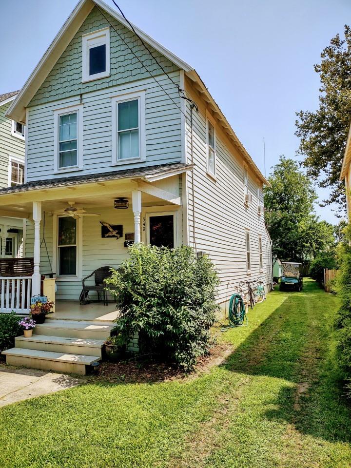 Updated Historic Home Just Blocks from the Beach, Shopping, Restaurants. This charming, move-in-ready home offers the perfect mix of character and modern updates. Enjoy a breezy front porch, shaded backyard with patio and shed, plus a private outdoor shower—ideal for beach living and entertaining. Inside, the renovated kitchen and baths blend style and comfort with thoughtful finishes. The open floor plan includes a spacious great room with attached half bath—perfect for gatherings or relaxing. Upstairs features 3 bright bedrooms and a full bath. Located just blocks from the beach, restaurants, and shops. Excellent rental history with many repeat guests. A turnkey gem with great income potential—don't miss out!