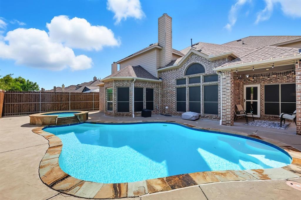 This 5-bedroom, 4-bath, 4,198 sq ft residence is more than a house, it's the perfect welcome home!

Step inside, where a gracefully curved staircase and rich hardwood floors guide you to the heart of the home. The living room has impressive two-story ceilings, a stone fireplace, and a wall of windows flooding the space with natural light, creating the perfect atmosphere for quiet evenings or lively gatherings. Beside it, the kitchen features new 2023 appliances, granite countertops, and a central island.

Your main-level primary suite offers a spa-like en-suite bathroom and a large walk-in closet, blending comfort with convenience.

Here, there is dedicated space for everyone. Unwind in the immersive media room for a true cinema experience, host game nights in two different game rooms, or gather for meals in the formal dining room.

Step outside to your private backyard oasis. The sparkling pool and spa create the perfect setting for summer barbecues or simply relaxing after a long day.

Enjoy the best of both worlds, with the convenience of Alliance Town Center just minutes away and the vibrant culture of downtown Fort Worth only a 20-minute drive. With nearby lake access, this location offers an unparalleled lifestyle of convenience, recreation, and entertainment.

Call or text to schedule your private tour.