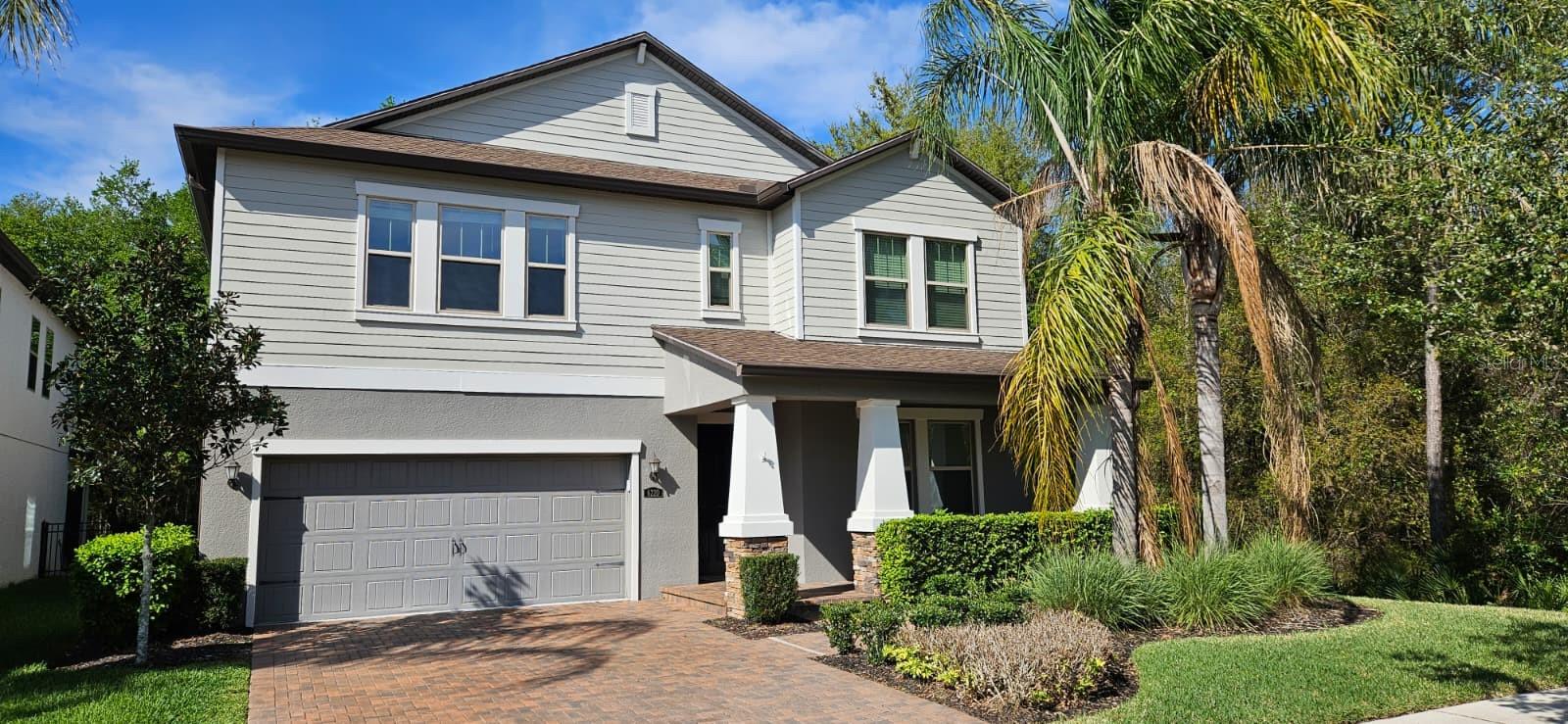 Seller Motivated! Substantial Price Reduction... An exceptional opportunity awaits with this spacious two-story home in the highly sought-after Stafford Place community of Tampa Palms. Home is centrally located and is few minutes away from I-75, Tampa Premium Outlet Mall, fine dining, theaters, lots of shops, family entertainment, BJs, Costco, and 5 minutes from University of South Florida. Few minutes from New Tampa Recreation Center with a playground, dog park, and a skate park. Home offers a three-car tandem garage, providing ample space to park and use it as a storage. As you step into the home, you are welcomed by a foyer and on the right a formal dining room, which can also be used as a front office. The dining room conveniently connects to the kitchen through a butler’s pantry. The kitchen features granite countertops, shaker-style cabinetry, and a large walk-in pantry. A spacious island with seating and a cozy dinette area overlook the expansive family room, creating an ideal space for everyday living and entertaining. On the main floor, you’ll find an additional laundry room, a half bathroom, and the primary bedroom suite featuring a spacious ensuite bathroom and a walk-in closet. The covered, screened-in lanai provides the perfect place to relax while enjoying beautiful conservation views. The backyard features steps leading to a thoughtfully designed paver courtyard with a stone fire pit and ample seating—ideal for enjoying the peaceful natural surroundings. The yard is fully enclosed with black aluminum fencing. Upstairs, the home offers four additional bedrooms, two bathrooms, and a main laundry room. A large bonus room provides the perfect space for a play area, media room, or family entertainment. Don’t miss the opportunity to call it as your home!!!