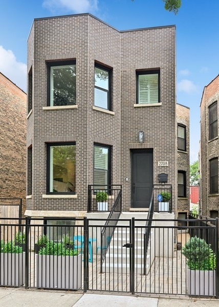 Experience Elevated Living in the Heart of Logan Square    Welcome to 2708 N Albany-a beautifully designed, expansive single-family home offering over 4,200 square feet of luxurious living space in one of Chicago's most vibrant neighborhoods. With 6 bedrooms and 4.1 bathrooms, this home is ideal for growing families, multi-generational living, or anyone who loves to entertain in style.    Step inside to soaring 10-foot ceilings, 8-foot solid-core doors, and white oak flooring that runs throughout the main and upper levels, creating a warm and refined atmosphere. At the heart of the home is a chef's dream kitchen featuring WiFi-enabled Thermador professional-grade appliances, an oversized 9.5-foot island with bar seating, quartz countertops, crisp white shaker cabinetry, a walk-in pantry, and a spacious eat-in dining area.    The sun-filled family room seamlessly connects to the kitchen and is highlighted by exposed wood ceiling beams and a sleek, recessed gas fireplace for cozy evenings at home.    A 12-foot rear addition enhances the upstairs footprint, allowing for four generous bedrooms-including a show-stopping primary suite with a spa-quality bathroom. Indulge in heated floors, dual vanities with quartz countertops, a water closet, freestanding soaking tub, and a luxurious steam shower with rain head, built-in bench, and glass enclosure.    The fully finished lower level includes two additional bedrooms, a full bath, a large recreation room with a mini wet bar, a utility room, and additional storage-including hookups for a second laundry area.    Out back, enjoy a private, fenced yard with a brick paver patio perfect for grilling and relaxing. A 2.5-car garage is topped with a composite rooftop deck, offering even more outdoor space for entertaining or unwinding.    This home combines timeless design with modern convenience-every detail thoughtfully considered. Come see it for yourself and fall in love.    Welcome home to 2708 N Albany.