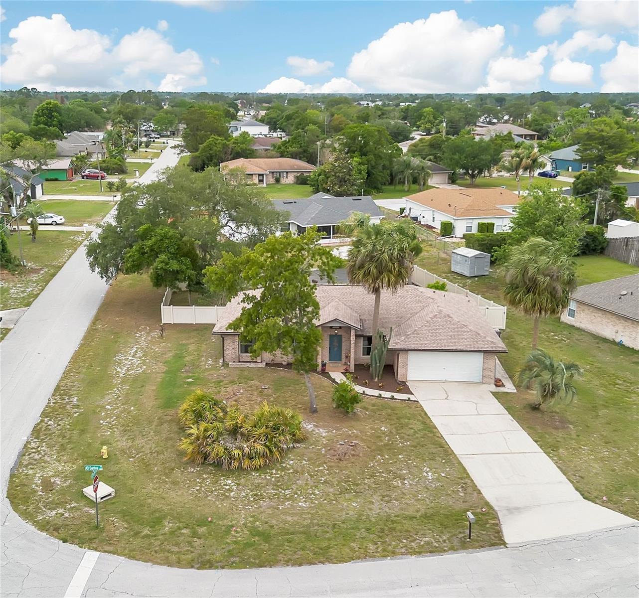 One or more photo(s) has been virtually staged. Roof (2022) + 6 Windows Replaced (2022) + Resurfaced Pool & Hot Tub (2021)—the big-ticket updates are already done so you can move in with confidence.  Bring your RV, BOAT, or TRAILER—this cutie sits on a fenced, oversized .28-acre corner lot with plenty of room to spread out.  Pool days and shaded afternoons under the covered porch are what this home is all about—paired with a layout designed for simple, everyday living.  Inside, you’ll find a more traditional, defined layout with no wasted space—just comfortable, functional living throughout. The living room features a wood-burning fireplace, and the kitchen offers granite countertops with easy access to the main living areas, along with a dining area.  The primary suite has direct access to the covered porch through the updated sliding glass door with built-in blinds, creating a nice transition to your outdoor living space. From there, step out to your private retreat with a screened enclosure, resurfaced pool and hot tub, and a backyard designed for relaxing or entertaining. (Propane tank for spa is leased.)  You’ll also appreciate the interior laundry room under AC—a must-have in Florida.  Concrete block construction with a faux brick exterior adds to the home’s structure and character.  Additional updates include a water heater and an AC system (approx. 10 years old)—both replaced from the original, plus a home warranty included for added peace of mind. Inside, you’ll find easy-care flooring throughout most of the home —ideal for low-maintenance living and those looking to minimize allergens.  Conveniently located with quick access to Interstate 4, making commutes to Orlando, Lake Mary, and Sanford easy, and close to local hospitals, emergency care, grocery stores, dining, and everyday essentials.If you’ve been looking for a home that’s easy to live in, easy to maintain, and ready to enjoy—this one checks the boxes.