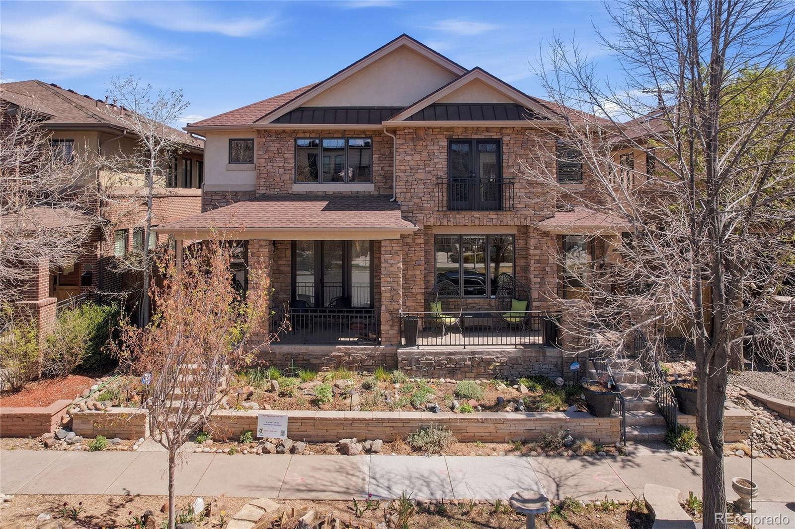 Luxury, Light, and Location. This meticulously updated residence offers a seamless blend of sophisticated design and high-tech functionality. Situated directly across from new construction priced over $2M, this home presents an incredible opportunity for the discerning buyer seeking turnkey luxury. Bathed in natural light from southern exposure and multiple skylights, this open-concept masterpiece features all-new designer paint and premium finishes throughout. The main level flows effortlessly from the formal living and dining rooms into the gourmet kitchen that is a chef’s dream or through the Butlers Pantry. Newly equipped with Wolf and Thermador appliances, the kitchen boasts a custom quartz island, open shelving, cozy gas fireplace and integrated smart lighting. Retreat to the upper level where the expansive primary suite serves as a true sanctuary, complete with a cozy gas fireplace, private dressing room, supersized walk-in closet, and a 5-piece spa-like bath with added cabinets. A second bedroom suite features elegant French doors with a custom screen door stunning views & attached full bath. This level is rounded out by a custom corner bar with quartz counter and cabinets, a dedicated workout space, and a private laundry center with ample cabinetry. The finished basement is an entertainer’s paradise, featuring a professional-grade built-in bar open shelving and a private guest suite with a full bath. Outdoor living is equally impressive with pollinator gardens on a new drip system, new private patio, dual gas lines for a BBQ and firepit. The attached oversized 2-car garage is drywalled with built-in ceiling storage, plus 220v outlet for smart car charging. Smart Home Tech: KASA automated lighting, motorized window coverings with blackout shades, Smart Appliances, Ring security system including door bell and lighting, app-controlled garage entry, keyless door entry, dog door and ramp, solar lights. See supplements for a complete list.