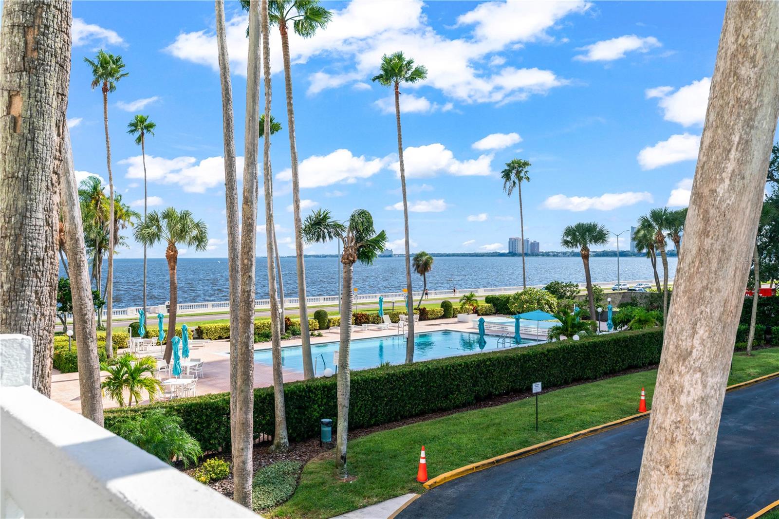 Rare opportunity to own a beautifully updated 1-bedroom, 1-bath residence in one of Tampa’s most desirable locations, where South Howard Avenue meets iconic Bayshore Boulevard! This light and bright home offers gorgeous water and pool views from both the living room and bedroom, with an open floor plan, spacious rooms, ample storage, and room for a king-size bed. The updated kitchen features granite countertops and stainless-steel appliances, while the updated bathroom and stylish porcelain tile flooring throughout add to the appeal. One of the building’s most desirable and rarely found features is PRIVATE IN-UNIT LAUNDRY, complete with an LG washer and dryer. A brand-new water heater provides additional peace of mind. Step onto the spacious balcony to enjoy your morning coffee, beautiful water views, or an evening dinner overlooking the pool and bay. The well-maintained community has also been nicely updated, including the lobby, common areas, and social room with full kitchen. Residents enjoy a resort-style pool, 24/7 doorman, covered parking, guest/private parking, locked bike room, and convenient trash chute. Located just steps from Bayshore Boulevard and minutes from SOHO, Hyde Park, Downtown Tampa, Tampa General Hospital, University of Tampa, Water Street, dining, shopping, and entertainment. A truly special opportunity to enjoy the best of the Bayshore lifestyle!