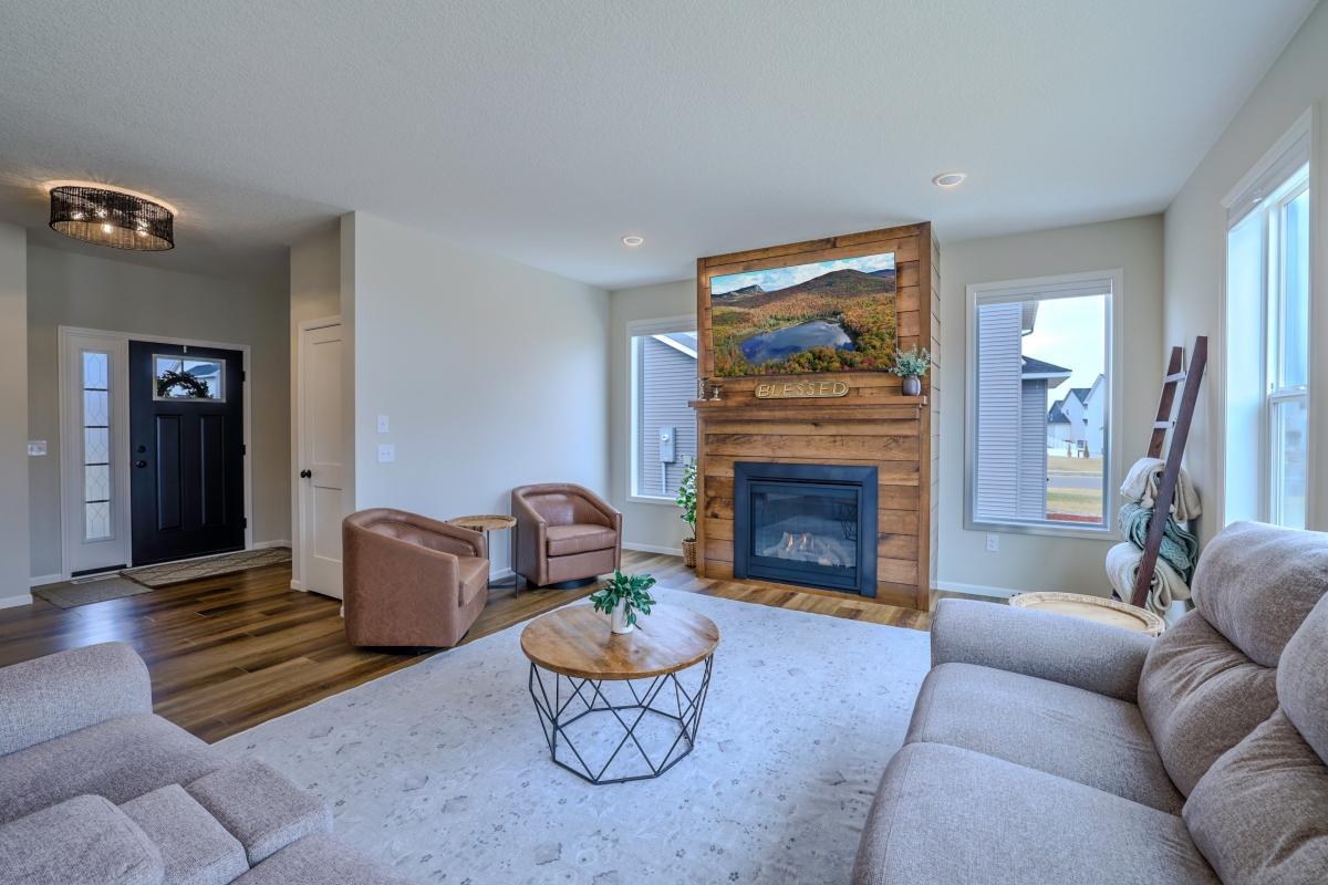 Beautiful custom options featured in this home. Former Keyland Homes Model. Custom options include the stained wood shiplap wrapped around the fireplace wall, extra and oversized windows, kitchen with custom island and stained corner cabinet with shelving, chair rail trimmed 1/2 bath with 2-tone paint, beadboard wall with hooks in upper level bath, and custom paint throughout, built in bench in the mudroom. This gorgeous former model has a gourmet kitchen featuring a wall microwave & oven, a center island with storage, walk-in pantry and cabinets with soft-close doors and drawers. Fully finished lower level has huge lookout windows and includes a family room area, 3/4 bath, and 2 private bedrooms, to make this a 5-bedroom, 3.5 bath home. New vinyl Fence. #1 rated Rosemount schools with a new elementary, and close by Brand new Lifetime fitness you can walk to with trails and parks in the surrounding area. Don't miss out on living in this wonderful community!