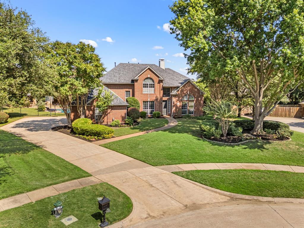 Luxury meets functionality in this updated 5-bed, 4-bath Southlake home with 3-car garage, nestled on a quiet cul-de-sac in a prestigious neighborhood with top-rated Carroll ISD schools. Freshly painted and filled with natural light, it features soaring ceilings, hardwood floors, a remodeled kitchen and primary bath, all secondary baths have also new quartz counter tops and sinks,  plus new lighting and fans throughout. The open, flexible layout offers ideal spaces for multi-generational living, home offices, or study areas. Major upgrades include two new AC units-coils (2023) and a tankless water heater (2024). Step outside to your private retreat with beautiful like new pebble-tec  pool, LED lighting, and app-controlled systems. A cabana with half bath, fridge, built-ins, and pre-wired TV complements a second covered patio with built-in grill—perfect for year-round entertaining. Surrounded by scenic trails and a fishing lagoon, this home offers elegant living, modern comfort, and timeless value in one of Southlake’s most sought-after communities.