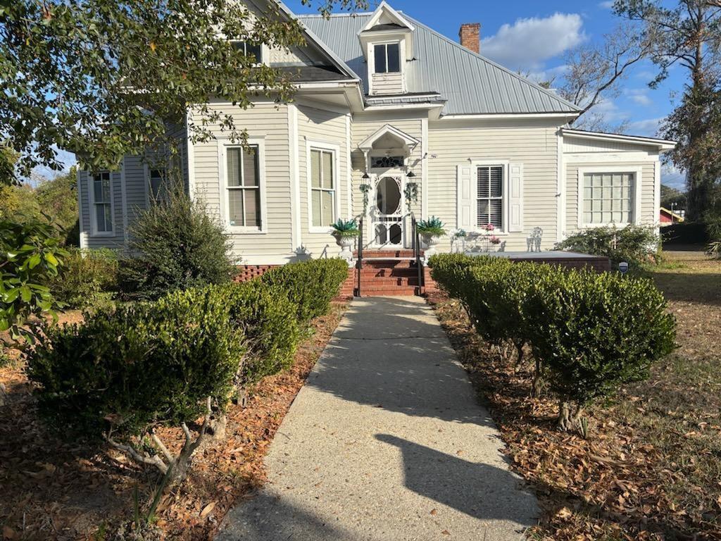 Take a step back in time.  Built around 1900, this lovely home has been restored with loving care. Large rooms and high ceilings provide lots of room for a family.  The attic could be turned into a play6 room or extra large bedroom. Located in Quitman (Brooks Co) GA . is recognized as a Historic Community