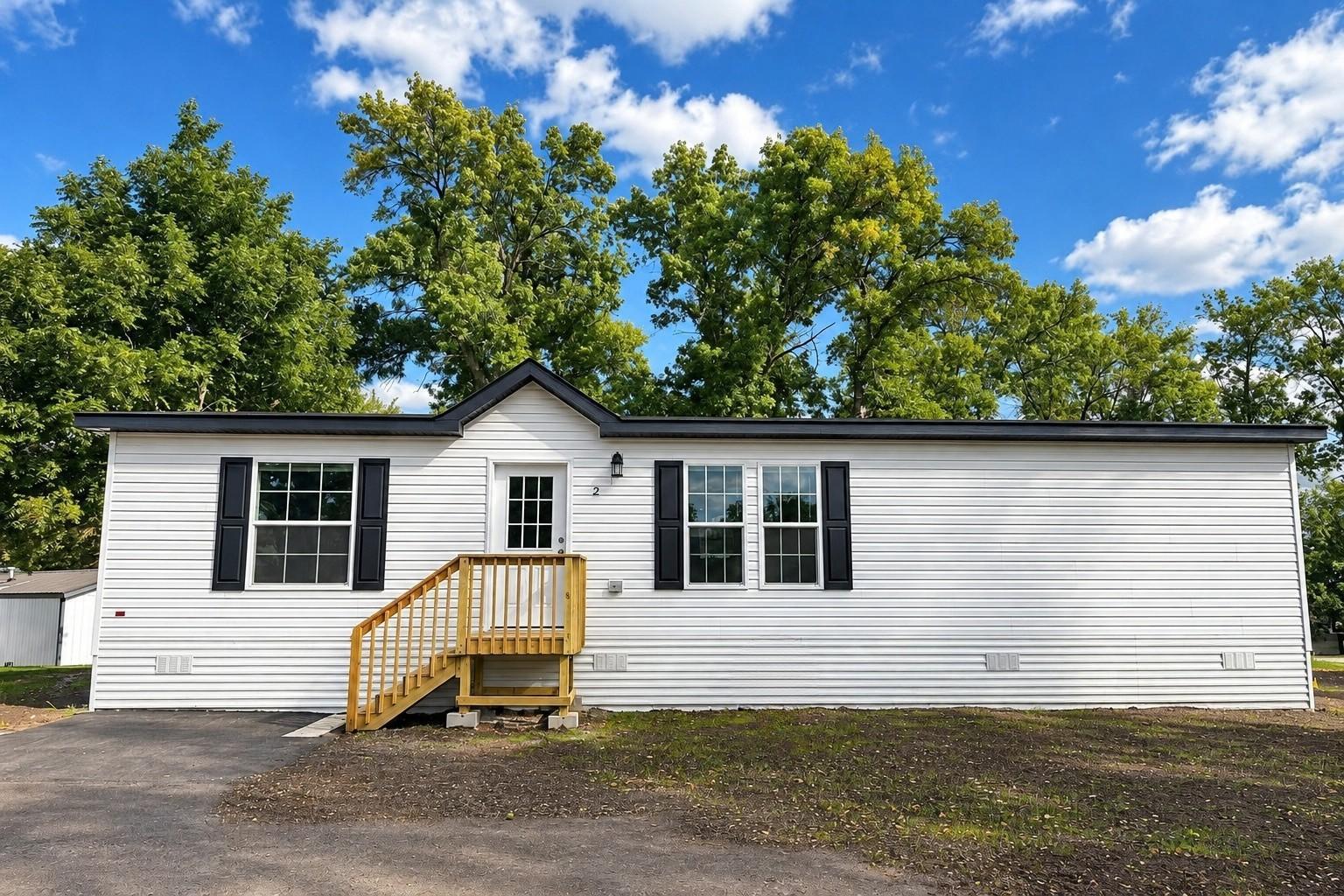 Brand-new Highland 28' × 48' double-wide manufactured home in Alexandria Estates! This 3-bedroom, 2-bath home offers a spacious, modern floor plan with approximately 1,280 sq. ft. of living space.The open living area provides plenty of room to relax or entertain, while the kitchen features brand-new appliances, generous cabinet space, and a large center island. The private primary suite includes its own en-suite bathroom, with two additional bedrooms and a second full bath providing plenty of flexibility.The classic white exterior with contrasting black shutters gives the home timeless curb appeal. Everything is brand new and move-in ready, including appliances, central air conditioning, landing, and skirting.Enjoy the benefits of a brand-new home without the repairs and updates that often come with an olderproperty.Home is located on leased land in Alexandria Estates. Lot rent is $415/month. Community approval is required. Financing options may be available for qualified buyers.