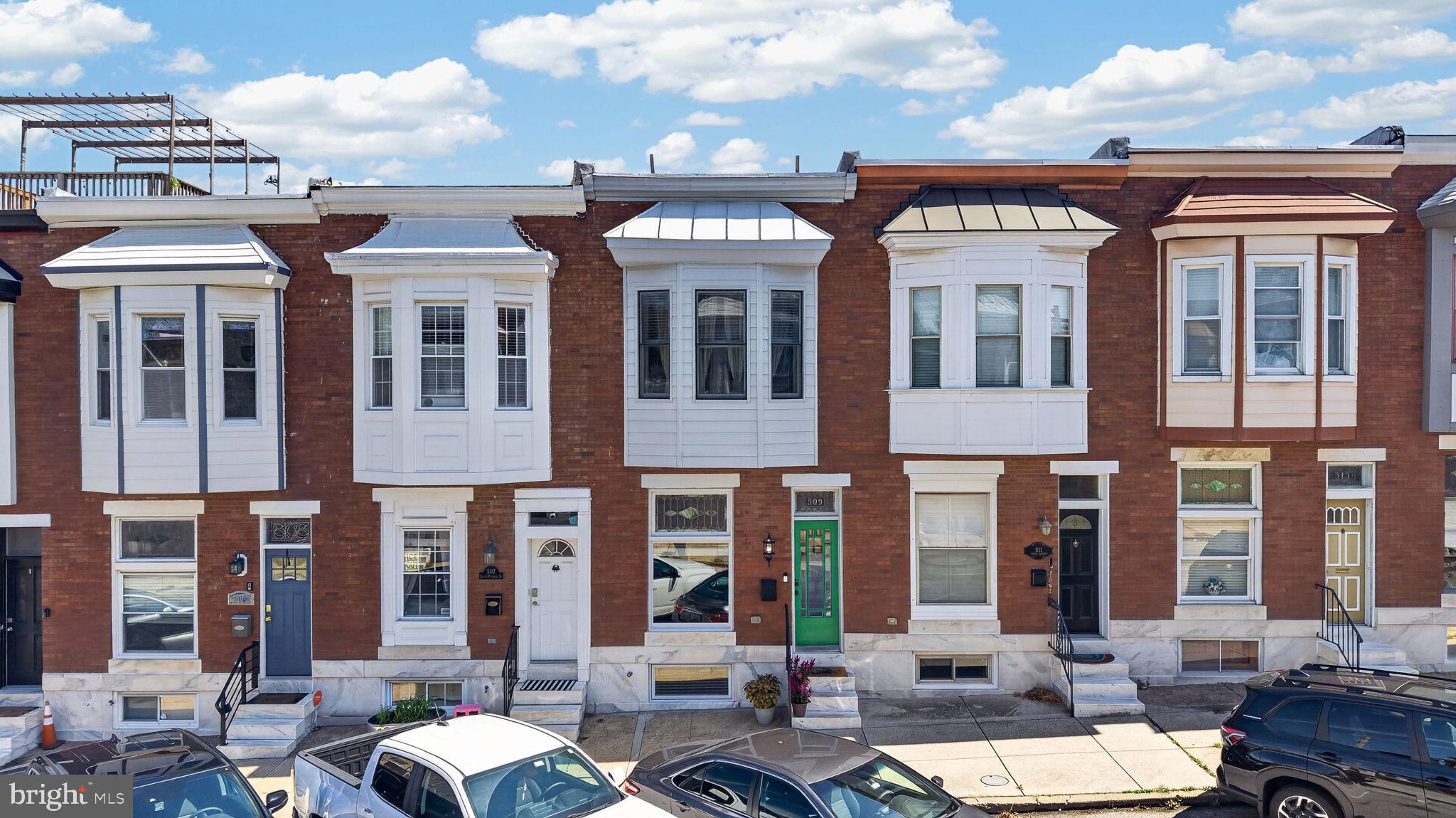 *OPEN HOUSE - Saturday, September 12th, 11 AM - 1 PM* This fabulous Canton rowhome offers private parking, a roof deck and an outstanding location. Plus, with almost 2 years remaining on its CHAP credit, there is significant tax savings through summer 2028. Canton is an awesome place to enjoy city living on the vibrant southeast side of Baltimore City. This home is situated less than a block from beautiful Patterson Park and is also nearby to the waterfront, O'Donnell Square Park, Brewers Hill, Highlandtown Arts District, restaurants and shopping. This home is so welcoming with stained glass windows, vintage tile, exposed brick and wood floors. On the main level, there is a charming entry vestibule, large living room, separate dining area and well equipped kitchen. The kitchen features stainless appliances, abundant storage, an island with seating, and easy access to the rear parking pad/patio. The upper level has the primary suite with a bedroom and attached bath, spacious second bedroom, second full bath and hallway access to the roof deck. The fully-finished lower level has two additional bedrooms, a third full bath,  laundry and stairs to the parking pad. The living space continues outdoors with a rooftop deck with amazing City views. Don't miss the opportunity to own this truly wonderful home. Schedule a tour today!