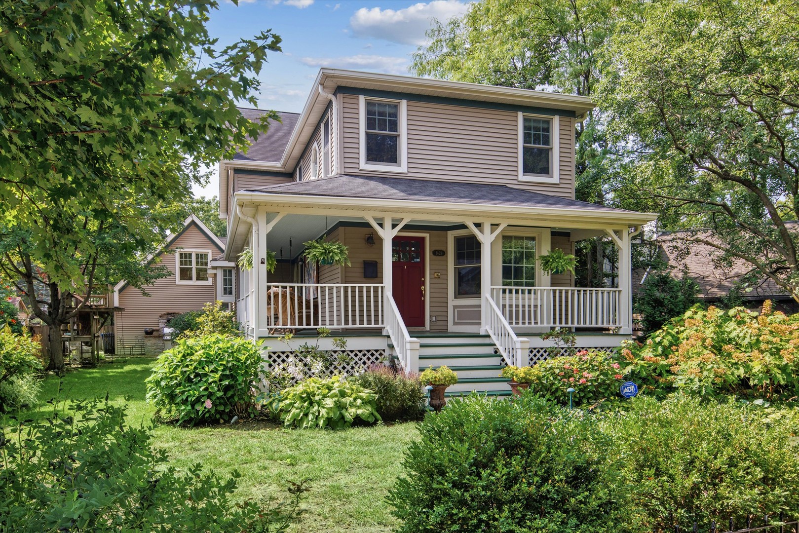 Set on a beautifully landscaped 1/4 acre lot in Wilmette, this 4-bedroom, 3.2 bath home is warm, livable, and full of character, featuring generous room sizes, thoughtful built-ins, and a layout with great flow and distinct living areas. There are spaces for gathering, spaces for quiet, and plenty of room for both. Inside, the serene formal living room greets you with tons of natural light, cushioned bay-window seating with underseat storage, and floor-to-ceiling built-in bookshelves. Through the living room is the gorgeous kitchen, both spacious and functional, with black granite countertops and natural stone backsplash, abundant wood cabinetry, separate island with a veggie sink and breakfast bar, stainless steel appliances and an eat-in breakfast nook for casual dining. Off the kitchen, a formal dining room with plenty of space for holiday entertaining. Glass panel pocket doors flow into the family room, which creates an open layout, featuring a wood-burning fireplace and built-in desk. Double French doors open off the family room to a screened-in porch, extending the living space through three seasons. A powder room rounds out the first level. The 2nd floor features four bedrooms and three full baths. The primary suite offers soaring 11' vaulted ceilings and opens to a huge south-facing deck overlooking the backyard. A roomy walk-in closet with adjacent stackable washer and dryer is the ultimate convenience, while the spa-like en-suite bath features radiant heated floors, a steam shower with built-in bench, and a separate Jacuzzi tub. The remaining three bedrooms each have their own personality: one with its own en-suite bath, another is lined with built-in cabinets and bookshelves, and the fourth bedroom has a separate sunlit reading nook. The game room is a separately accessed bonus space, sitting above the garage and accessed from inside the home, currently set up for billiards and ready to welcome your home office, workout room, or bonus lounge space. The partially finished basement with radiant heated floors offers room for movie nights plus plenty of additional storage, a 2nd powder room and 2nd laundry area with a full-size, side-by-side washer and dryer. Outside, a side yard with brick pavers and a built-in stone grill is set up for warm weather cooking, and a treehouse that needs nothing but imagination. The larger, full backyard provides perennial gardens and lush areas to play and relax. Rare attached and heated two-car garage is just one more thing to love about this home. Incredible location in the heart of it all: walk to McKenzie School, the Metra, downtown Wilmette shops and restaurants!