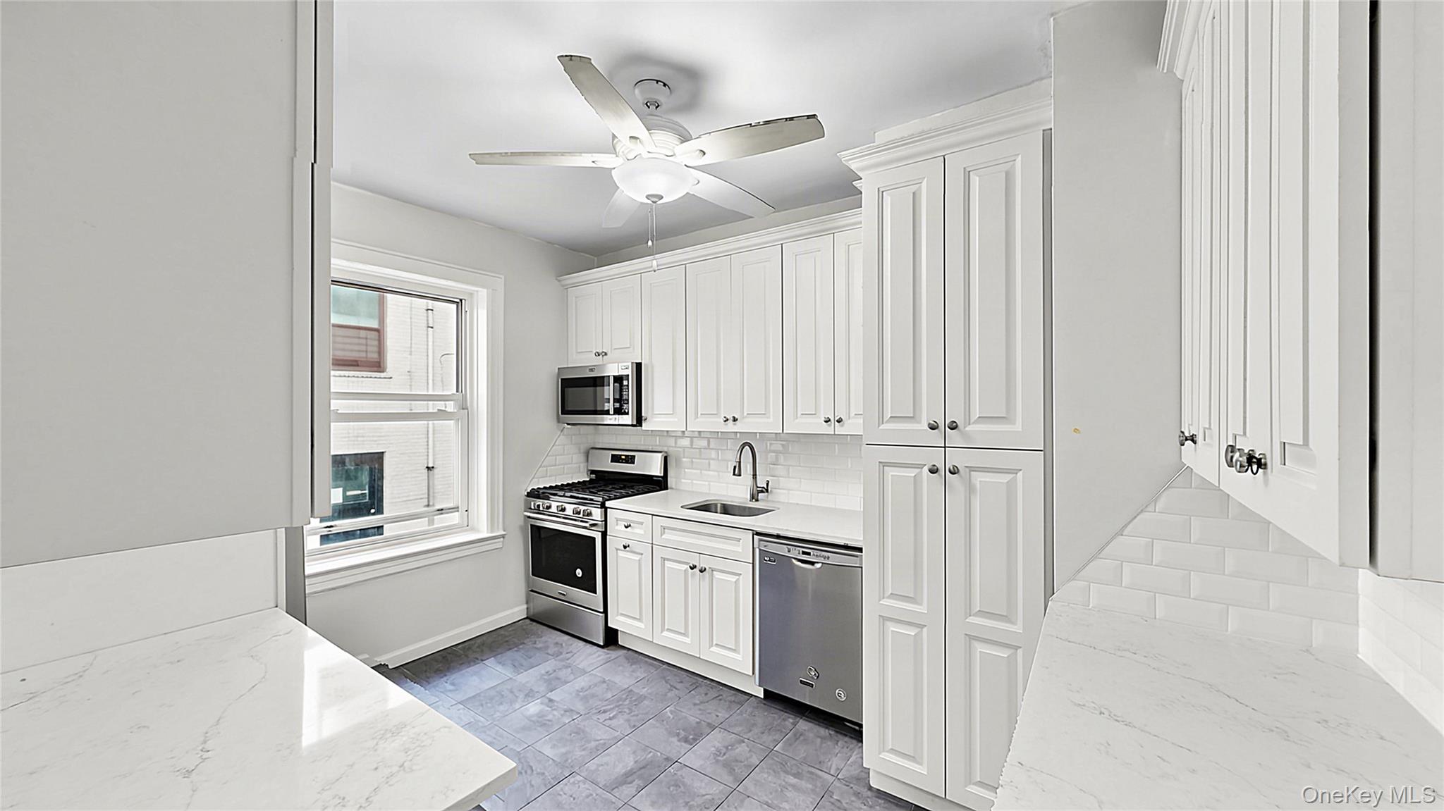 Welcome to Laurel Hill Manor, a well-maintained pre-war co-op in the heart of Sunnyside.This spacious true two-bedroom features generously proportioned rooms, high 9-foot ceilings, refinished hardwood floors throughout, fresh paint and excellent storage with four closets. Its convenient first-floor location offers easy everyday access.The renovated kitchen features elegant marble-look quartz countertops, stainless steel appliances, dishwasher, microwave, abundant cabinetry and a convenient breakfast counter with seating for two. Both the kitchen and bathroom are windowed, providing natural light and ventilation. The apartment features eastern and courtyard exposures, with morning light in the bedrooms and windows throughout the home.Enjoy one of Sunnyside's most convenient locations, close to supermarkets, restaurants, bars, cafe's and neighborhood favorites along Queens Boulevard and Greenpoint Avenue. The Sunnyside Greenmarket on Skillman Avenue is also just a few blocks away.The building features a ButterflyMX video intercom system for convenient guest access.Excellent transportation options: just 3 short blocks to the 40th St-Lowery St 7 train, only a few stops to Long Island City and approximately 15 minutes to Grand Central. Greenpoint and Williamsburg are also easily accessible via the B24 bus along Greenpoint Avenue, while nearby Citi Bike stations provide another convenient connection to North Brooklyn.Subletting permitted after two years of owner occupancy with co-op board approval.No pets permitted.