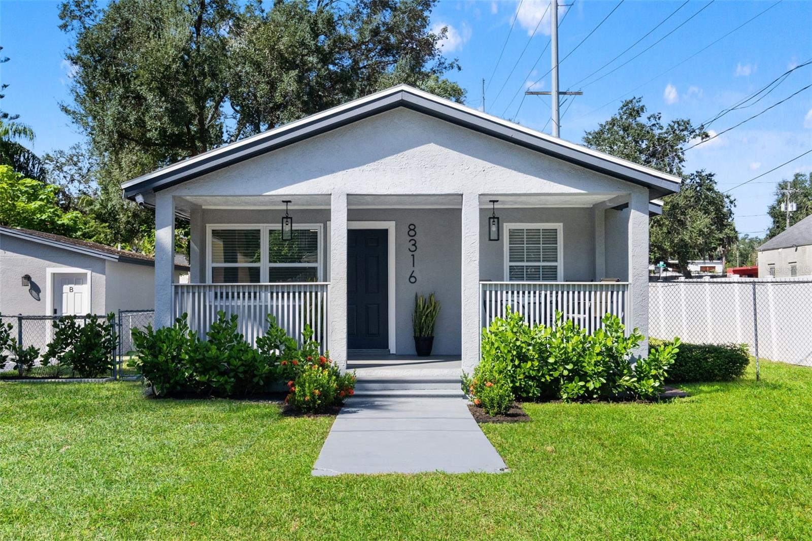 TWO HOMES FOR THE PRICE OF ONE! Looking for an opportunity to house hack or generate additional rental income? This unique Tampa property features a move in ready 3 bedroom, 2 bathroom 936 SQFT main residence along with a detached guest house! Live in one and rent out the other to help offset your mortgage, utilize both as income producing properties, or create the perfect setup for multigenerational living.The main residence welcomes you with a large covered front porch before stepping inside to a completely open floor plan featuring vinyl flooring throughout the main living areas. The kitchen offers ample cabinet and counter space, shaker style cabinetry, granite countertops, stainless steel appliances, a stylish tile backsplash, and a large bar top. All three bedrooms have plenty of space, while both bathrooms are updated including newer vanities. A dedicated utility and laundry room provides plenty of additional storage. Outside, the main home features its own fenced backyard, side deck, and a private back patio, perfect for relaxing or entertaining. The property also offers additional space for RV, boat, or camper parking. The detached 480 square foot guest house offers an entirely separate living space with an open floor plan, kitchenette, one bedroom, full bathroom, and its own central AC system. With a private front patio and separately fenced backyard, this additional residence provides plenty of privacy and separation from the main home, making it ideal for a long term rental, potential Airbnb, or private accommodations for extended family and guests.Conveniently located with easy access to major highways, Downtown Tampa, USF, Busch Gardens, shopping, dining, and more. Two move in ready residences, private outdoor spaces, and a versatile layout make this property a rare find in Tampa!