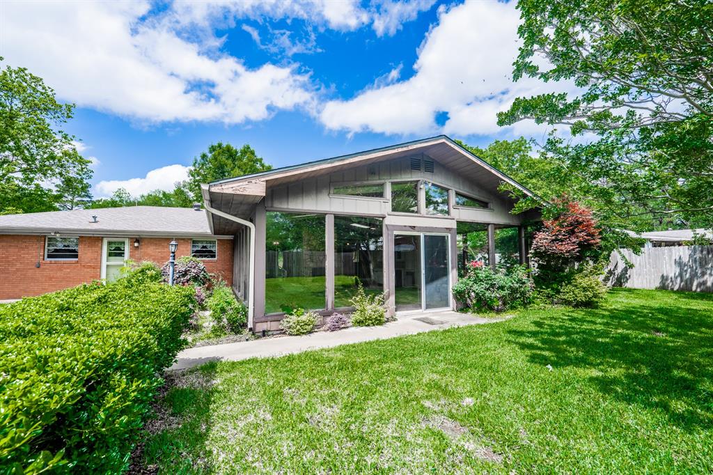 In the heart of southern Sulphur Springs is where you'll find this delightful 3 bedroom, 2 bathroom house with 3 living areas. The kitchen comes with plenty of storage and a separate cabinet area that will make a perfect coffee nook. At the back of the house is a large vaulted great room with wood-burning stone fireplace, a wall of windows, wet bar with mini-fridge, skylights, and access to the green backyard. A front living could be closed off to use as an office or keep as a formal living space. Use of the third living area can be used a formal dining room. Three spacious bedrooms gives you room to spread out with one bedroom that has access to the great room. An attached 2-car garage provides a place for your cars or use part of it as a workshop. Near restaurant chains and shopping, this established neighborhood gives you convenience and easy access to all the city amenities. Family and guests will have plenty of room with over 2,591 square feet!