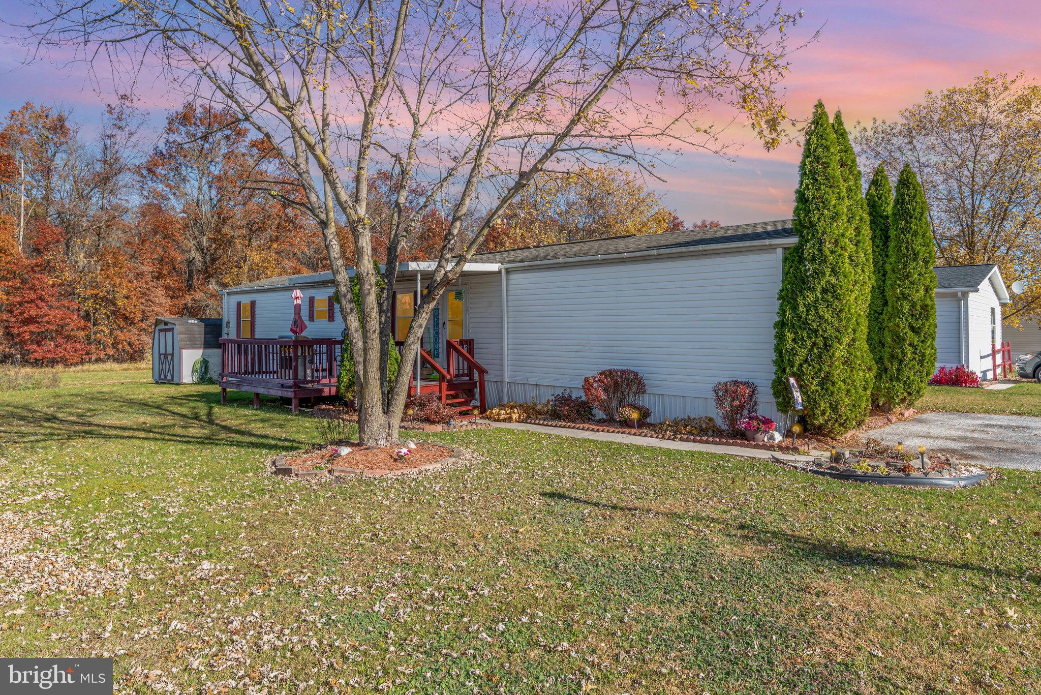 This 3 bedroom, 1 bath home in Walnut Grove Mobile Home Park offers comfort, updates, and a peaceful setting backing to the woods. Recent improvements include updated flooring in the hallway and kitchen (2025), a new bathroom vanity (2024), and a new refrigerator (2024). Bedroom 2 was freshly painted in 2025, giving the space a bright and welcoming feel. This lot features an extended lot that are bigger than most lots in the neighborhood and backs to the woods.