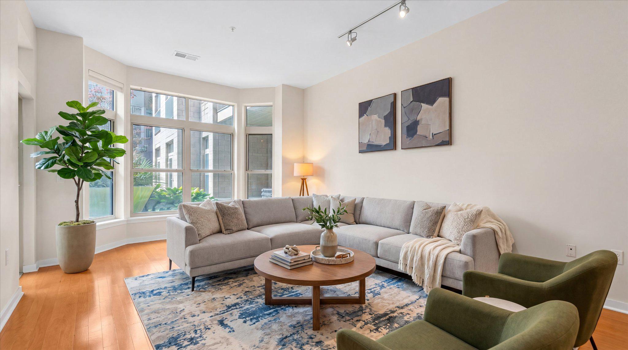 Experience elevated city living at 1209 N Charles, one of Midtown/Mount Vernon’s most coveted luxury condominium residences. Overlooking the beautifully landscaped interior courtyard, this sophisticated two-bedroom plus den residence is filled with exceptional natural light from every room, creating a warm and inviting atmosphere throughout.Inside, the residence has been thoughtfully updated with a stunning custom European-style kitchen featuring luxury appliances, including a Bosch five-burner gas range, Liebherr refrigerator, Asko dishwasher, new tile flooring, and quartz countertops with an expanded breakfast bar designed for both everyday living and gathering. The large living room features a beautiful bay window that fills the space with light throughout the day, and the versatile den offers ideal flexibility for a home office, library, or more formal dining.A standout feature of the home is the private patio surrounded by lush greenery and offering direct access to the courtyard itself. Elevated two stories above street level, the space offers a hidden urban garden retreat, equally suited for quiet morning coffee or effortless entertaining.1209 N Charles offers residents a beautifully maintained courtyard, fitness center, secure entry, and garage parking, all in an unbeatable location, steps from the University of Baltimore, the Baltimore Symphony Orchestra, theaters, cafés, restaurants, and the cultural heart of Mt. Vernon. Just three blocks from the day/night Johns Hopkins shuttle and Penn Station, with easy MARC and Amtrak access to Washington, New York, and beyond, this is refined urban living with both convenience and tranquility woven seamlessly together.