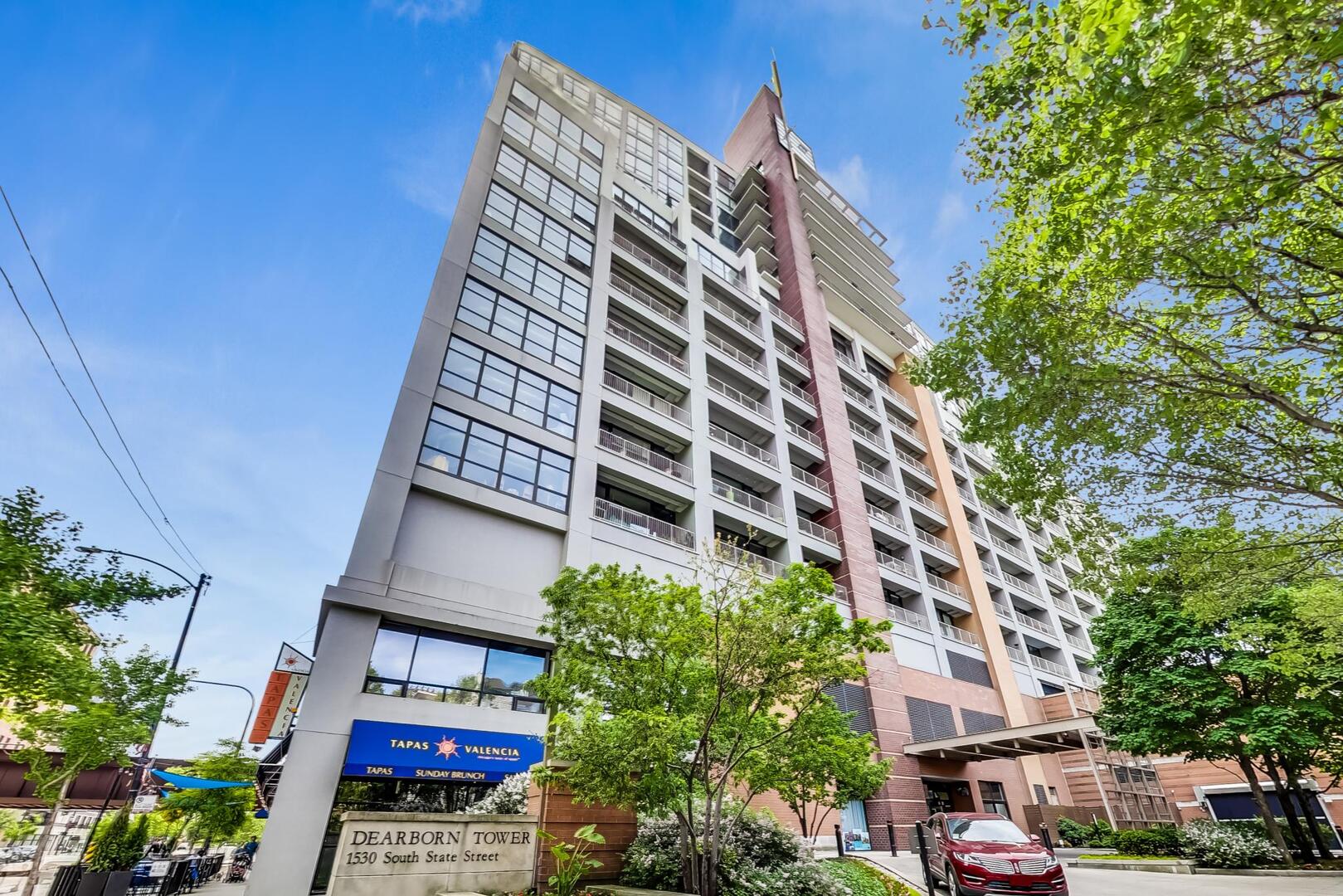 Rarely available southeast corner 2BD/2BA at Dearborn Tower! This bright and spacious home has extraordinary outdoor space, including a 43'x39' private terrace and a 13'x5.5' balcony with forever lake and skyline views. Interior highlights include hardwood floors, a chef's kitchen with honed granite countertops, upgraded cabinetry, professional appliances, dedicated bar with wine fridge and beer tap system with cooler.   The  oversized island seamlessly connects to the dining and living areas. The primary suite features a renovated spa bath with double vanity, large walk shower, and a professionally organized walk-in closet. The second bedroom offers direct access to the terrace along with its own updated spa-like bath. Additional features include in-unit laundry and abundant closet space. Full amenity building with 24/7 door staff, fitness center, sundeck, bike room, and extra storage. One PREMIER deeded garage space available for $35k.   Steps from trendy restaurants, parks, the lakefront, Soldier field, Whole Foods, dog parks, CTA, and more.