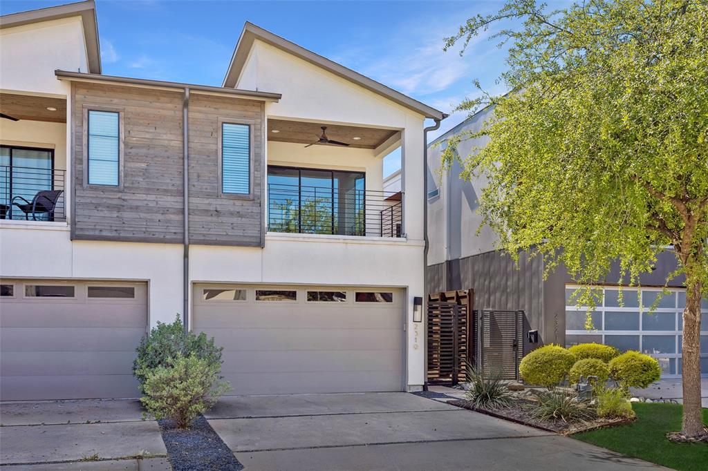 This move-in ready, two-story single-family attached home in East Dallas offers modern design, thoughtful functionality, and an inviting layout perfect for everyday living and entertaining. Lightly lived in and impeccably maintained, the home features clean, sleek finish-outs and an open-concept floorplan filled with natural light. The spacious kitchen and living area serve as the heart of the home, highlighted by an oversized island with quartz countertops, a wet bar, and a cozy fireplace. Sliding doors seamlessly connect the indoor space to a private backyard complete with a covered patio and privacy fence—ideal for relaxing or hosting guests. A private study is conveniently located on the first floor, providing a quiet work-from-home retreat. Upstairs, all bedrooms are thoughtfully situated alongside a versatile loft area, balcony, and an additional wet bar for added convenience and flexibility.The primary suite is a true retreat, offering a spa-like bathroom and a generous walk-in closet. Wood flooring runs throughout most of the home, with tile in wet areas and closets. Black-framed windows and a gated front entry add both style and privacy to this exceptional property.