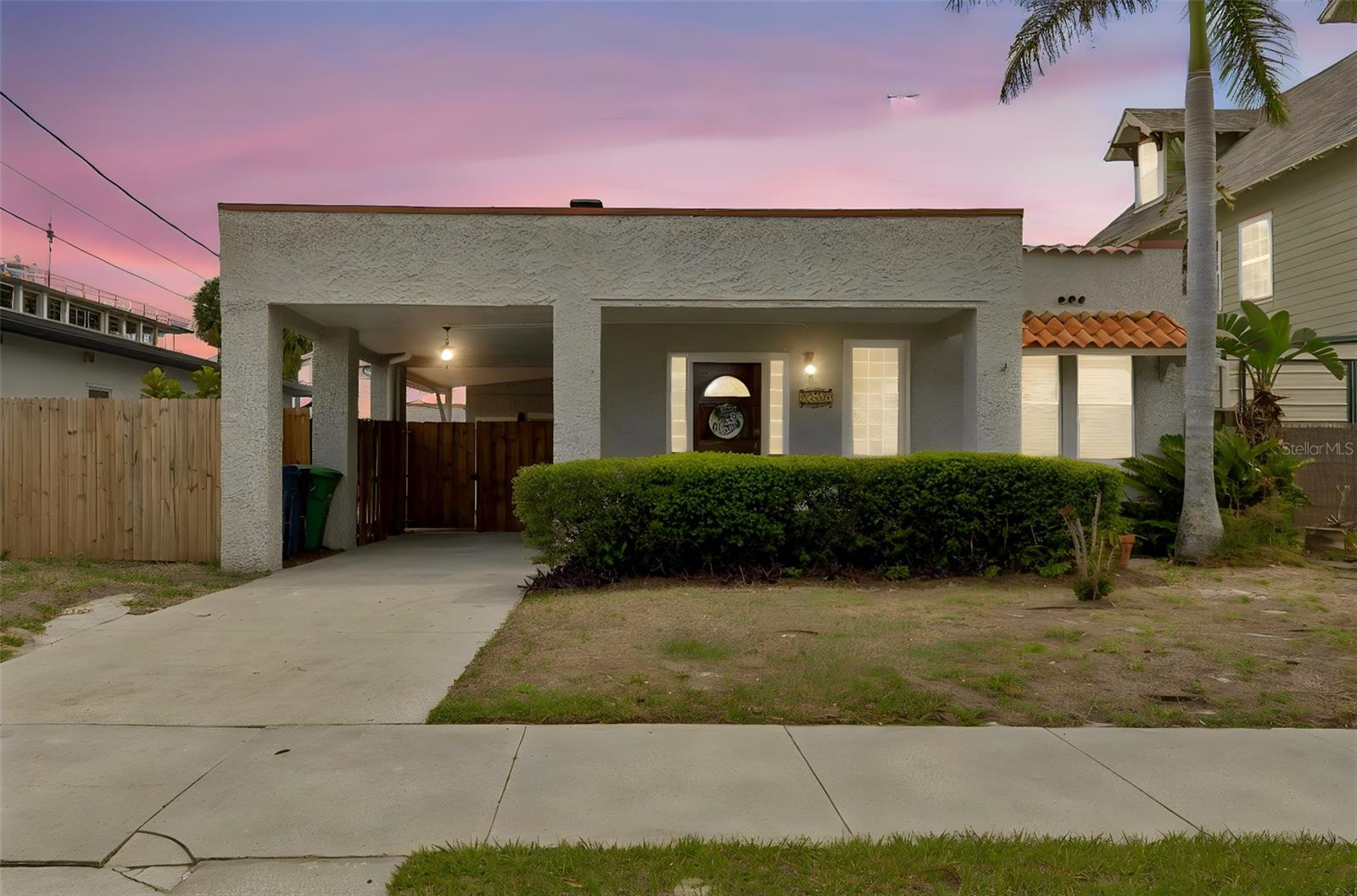 Own a piece of Tampa history with this charming 1920s Mediterranean-style home, rich in character yet thoughtfully updated for modern living. Showcasing Tampa’s iconic Spanish Mediterranean architecture, the home welcomes you with a quintessential covered front porch and timeless curb appeal. You will find covered parking with access to both the front and side entry doors, ideal for the Florida rainy season. Inside, you’ll find freshly painted interiors complemented by beautifully refinished original heart-of-pine hardwood floors in the front living spaces, preserving the home’s historic warmth. The updated kitchen features stainless steel appliances, gas range and new quartz countertops. The guest bathroom has been tastefully renovated. A light-filled third bedroom with French doors offers flexibility as a home office or studio. The spacious 19x10 laundry/bonus room provides endless possibilities—ideal for a gym, or additional living area. Step outside to enjoy a 240 sq ft covered side patio overlooking a serene brick-paved courtyard with a relaxing water feature—perfect for entertaining or unwinding. Major updates include a 2022 roof and a 2019 HVAC system and newly rebuilt back deck. The detached oversized storage building matches the home and ready for you for the next owners vision for this space. The property sits on a 54x100 lot (5,400 sq ft), zoned RM-16 (residential multi-family) in the desirable Mitchell/Wilson/Plant school district.Located in Armory Gardens—one of South Tampa’s fastest-growing neighborhoods—this home is on a sidewalk-lined street and in Flood Zone X (no mandatory flood insurance). Enjoy a walkable lifestyle just minutes from Villa Brothers Park, the JCC, and close to local favorites like Alessi Bakery, Psomi, Acropolis, and Miguel’s. Midtown Tampa, University of Tampa, Downtown, the Riverwalk, major hospitals, MacDill AFB, and Tampa’s championship sports venues are all nearby, with Gulf Coast beaches just a short drive away.This is a rare opportunity to own a historic gem in the heart of South Tampa.