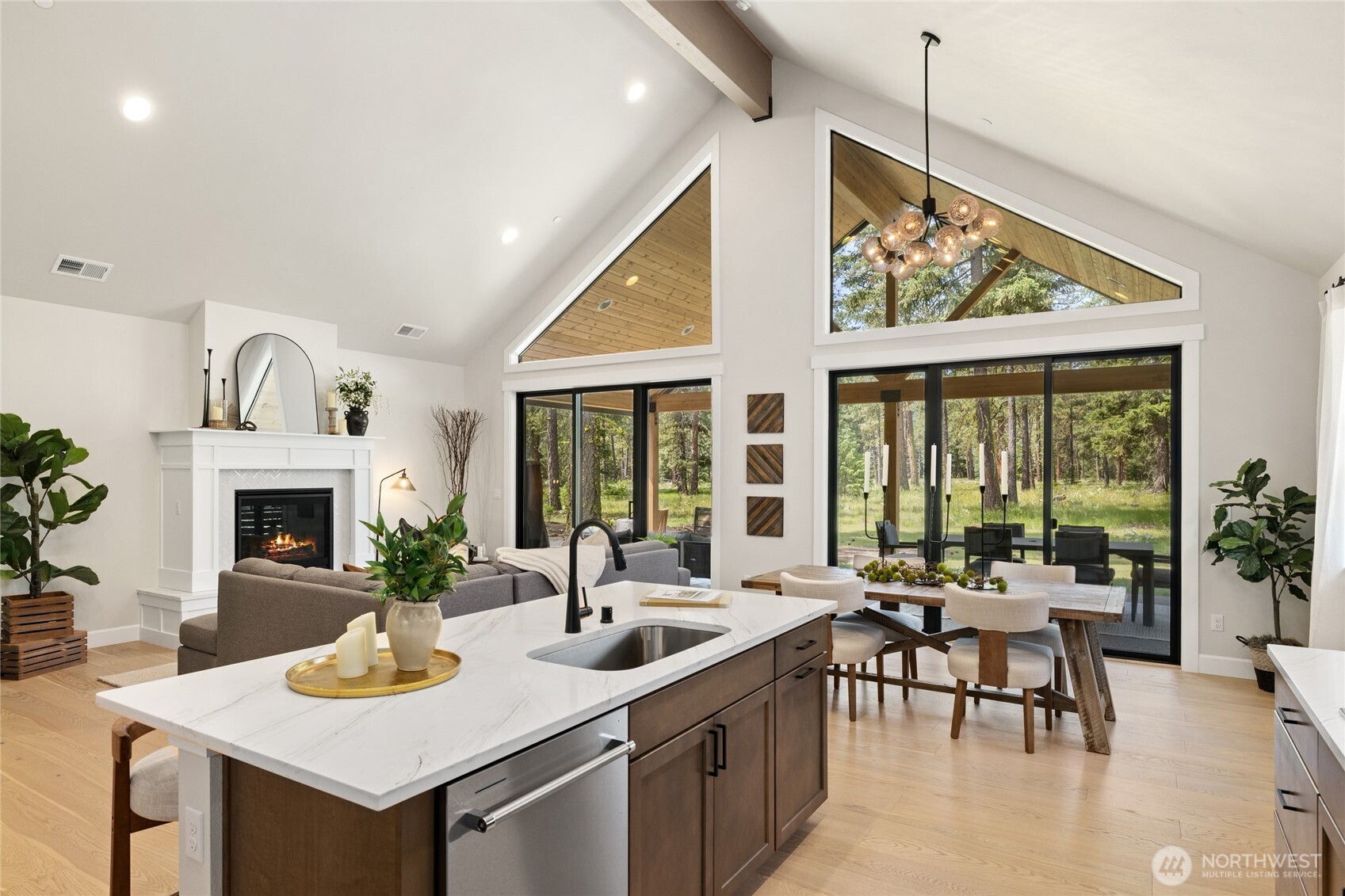 Bright open, and inviting living room with large beam.