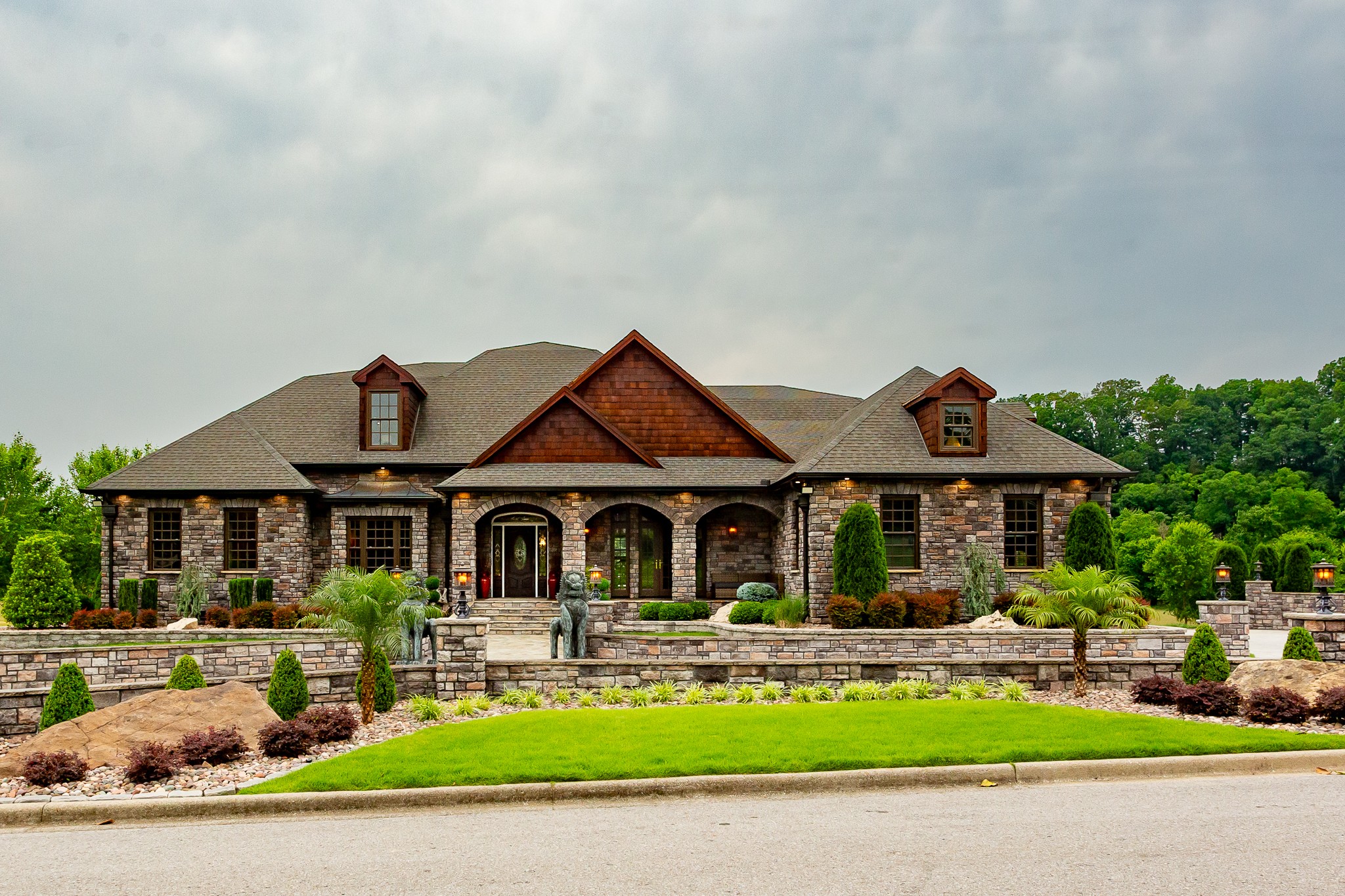 CUSTOM LUXURY ON THE RED RIVER – A MUST SEE!  Prepare to be impressed by this one-of-a-kind home featuring custom finishes throughout and located on 1.13 acres with no backyard neighbors, backing up to the scenic Red River.  This expansive home offers 4 bedrooms, 4.5 bathrooms, a bonus room, gathering room, sun room, formal dining, living room, and kitchen/breakfast area—perfectly designed for both everyday living and entertaining.  Step inside and experience the warmth of custom stone, tile, and wood details on the walls, floors, and ceilings. Each bedroom includes a walk-in closet with custom shelving and a private bath, ensuring space and privacy for everyone.  The kitchen is a chef’s dream with LG slate appliances, granite countertops, glass-front cabinets, a farmhouse sink, and a walk-in pantry with custom shelving. You’ll also love the butler’s pantry with elegant glass-front cabinetry.  The primary suite is a true retreat, featuring a Whirlpool tub and a huge walk-in shower.   Additional highlights include a 3-car garage, mudroom with bench, and a laundry/utility room.  Outside is a showstopper—enjoy extensive professional landscaping, a 2-level gas fire pit with 5 burners, a water fountain, outdoor kitchen, and plenty of room to add an in-ground pool.  This home has it ALL—and then some! Check the media section for a full list of upgrades and custom features.