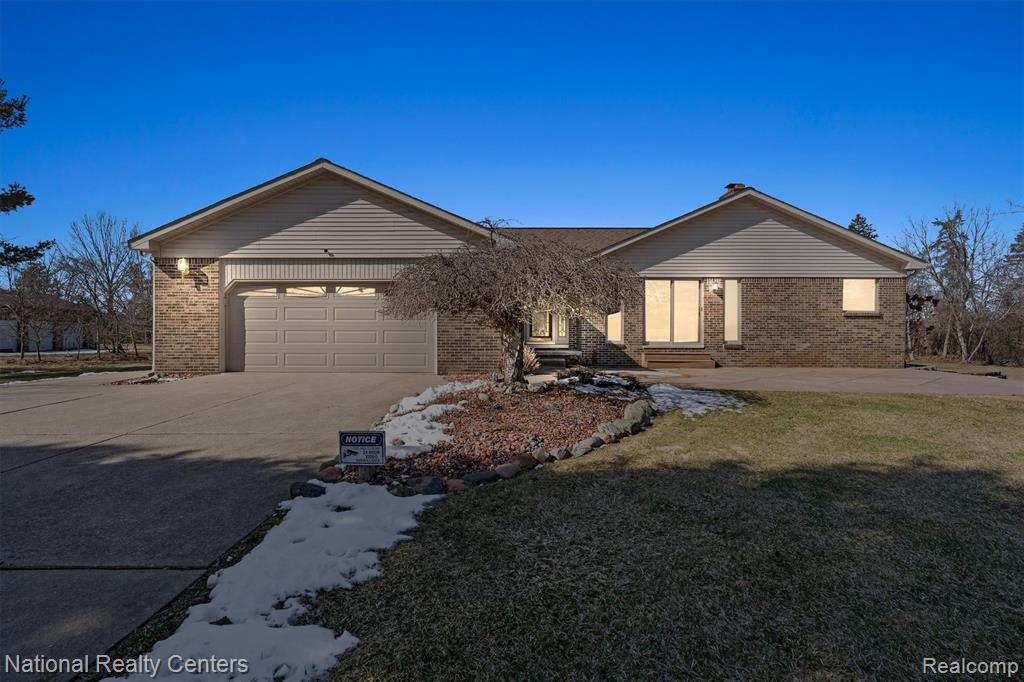 Prime Lakefront location between downtown Plymouth and Ann Arbor! Custom built 3 bed/3 bath ranch with attached 2 car garage set on a picturesque 2-1/4 acre lot abutting unbuildable additional 2 acres and overlooking a 19-acre private spring fed lake with lots of wildlife and great fishing! The gourmet kitchen features Kraft Maid Cabinets, Cambria Quartz, hardwood floors, and stainless steel appliances. The great room offers stunning lake views, a cozy fireplace, wet bar, and opens to a stamped concrete patio-perfect for enjoying the serene setting and private cul de sac location. The large primary suite with private bath/jetted tub has its own doorwall to composite deck and lots of closet space. A convenient first floor laundry and mudroom is located just inside the garage entrance to the home. The finished basement nearly doubles the livingspace with a large rec room, full kitchen, 3rd full bath, and office. A detached 1 car garage and separate storage shed provide plenty of room for outdoor equipment and storage. Manyupdates in 2024 including new roof, water heater, and water pressure tank, water softener/filter in 2023. New HVAC in 2017. The original owners lovingly cared for this home, and it shows! All of this is tucked in a prime location that delivers true country living just minutes from Ann Arbor and downtown Plymouth, with quick access to major freeways.  Must See! Agent is related to seller.