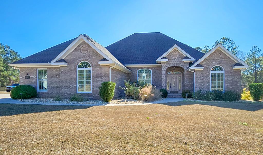 Live where luxury meets function in this exceptional 4-bedroom, 3.5-bath all-brick home situated on 1.32 acres with tranquil views of two private ponds in Thomasville's sought-after Sweetbriar Lakes community — just minutes from shopping, dining, and schools.  Designed for refined living and everyday comfort, this home features a glassed-in sunroom with its own dedicated mini split HVAC system, providing year-round enjoyment of the beautiful water views, along with a custom-built, climate-controlled gun room — a rare and highly desirable amenity. But if you don't need a gun room, you can use it for storage or a playroom, whatever your needs are!  The chef's kitchen is anchored by a striking brick-surround induction cooktop, custom cabinetry, stainless appliances, and hard-surface countertops that flow seamlessly into the spacious living and entertaining areas. A stunning, custom crystal, imported chandelier from Czechoslovakia serves as a one-of-a-kind statement piece in the formal dining room.  The spacious primary suite offers a relaxing retreat with a walk-in Jacuzzi soaking tub. Throughout the home you'll find tray ceilings, crown molding, arched doorways, recessed lighting, a gas-log fireplace, formal dining room, and a generous family room ideal for gatherings.  The home office space is flexible as a 5th bedroom or as a bonus room. Step outside to enjoy the huge fenced patio overlooking peaceful pond views and perfect for entertaining, all within a wonderful neighborhood with great neighbors.  This move-in-ready property delivers luxury, craftsmanship, and lifestyle in one truly special home.