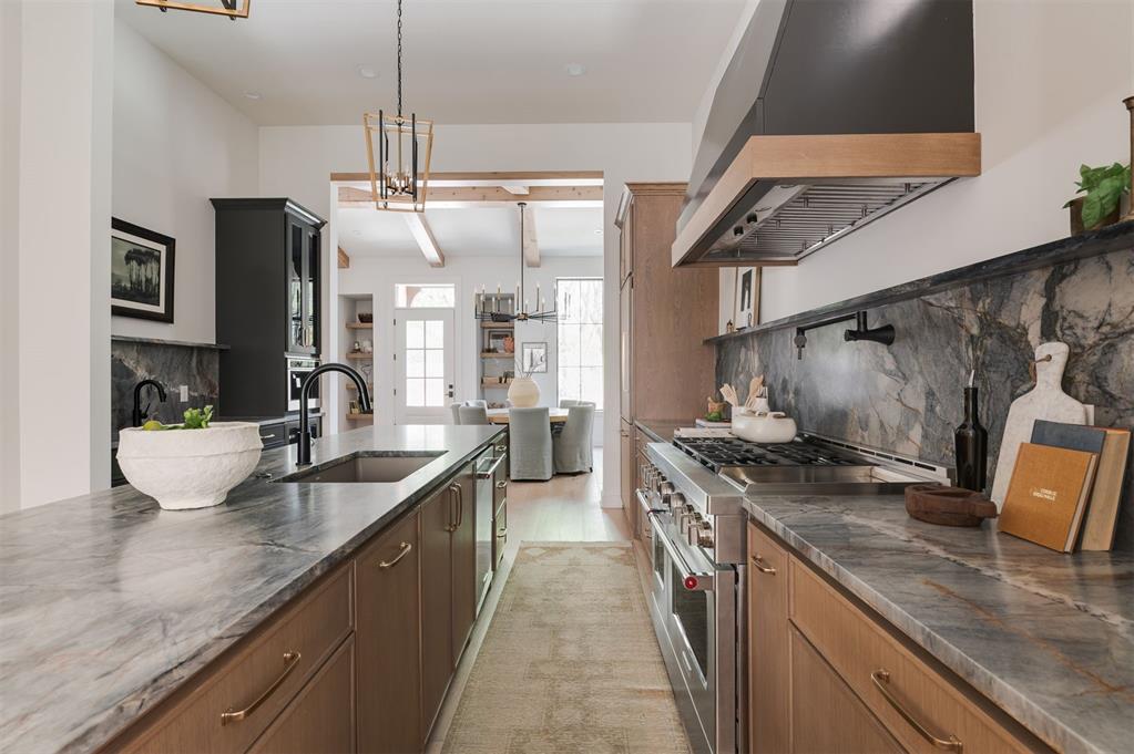 6 Time Award winning custom home in The North Shore, OKC's newest urban neighborhood nestled in the heart of Lower Scissortail Park. The Fall 2025 Parade of Homes awarded this home the BEST OVERALL HOME, INTERIOR FINISH, CURB APPEAL, FLOOR PLAN and OUTDOOR LIVING! It's a must see! A cedar beamed cathedral ceiling flanked by a pair of floor to ceiling curio cabinets welcome you home. Just beyond, a stunning oversized chef’s kitchen exudes a refined lifestyle with Brazilian quartzite surfaces & solid white oak shaker cabinetry. A beverage station includes a wet bar, cooler & espresso machine making daily life & entertaining a breeze! You’ll love the 10+ foot center island, Kitchen Aid Professional appliances including a 48 inch 6 burner gas range + griddle & a true butlers pantry, separate from the main kitchen. Cozy up to the fire either in the main living room (with a Pecky Cypress accent wall & hidden powder bath) or just beyond the double glass sliding doors in your private courtyard. Relax upstairs in the second oversized living room or retreat to the three private bedrooms, each with an ensuite bath. Situated on its own wing, the dreamy primary suite offers a true respite from the world featuring a soaking tub, custom glass shower & an oversized walk-in closet. Designer paint, wallpaper, fixtures & hardware throughout the home add effortless style & appeal. Adjacent to both the lower Scissortail Park & the Oklahoma River, your opportunities for exploring the outdoors are unlimited! You'll find soccer, pickleball & basketball courts, paved sidewalks & an oversized lake with kayaking in the park plus year round planned events like farmer's markets & concerts on the great lawn. The Oklahoma River offers rowing, kayaking & paddle boarding options with an additional 100+ miles of continuous paved trails connecting you to the OKC Greater Metro. Located in the award winning John Rex School District too! Schedule your private tour today & make your dream a reality!