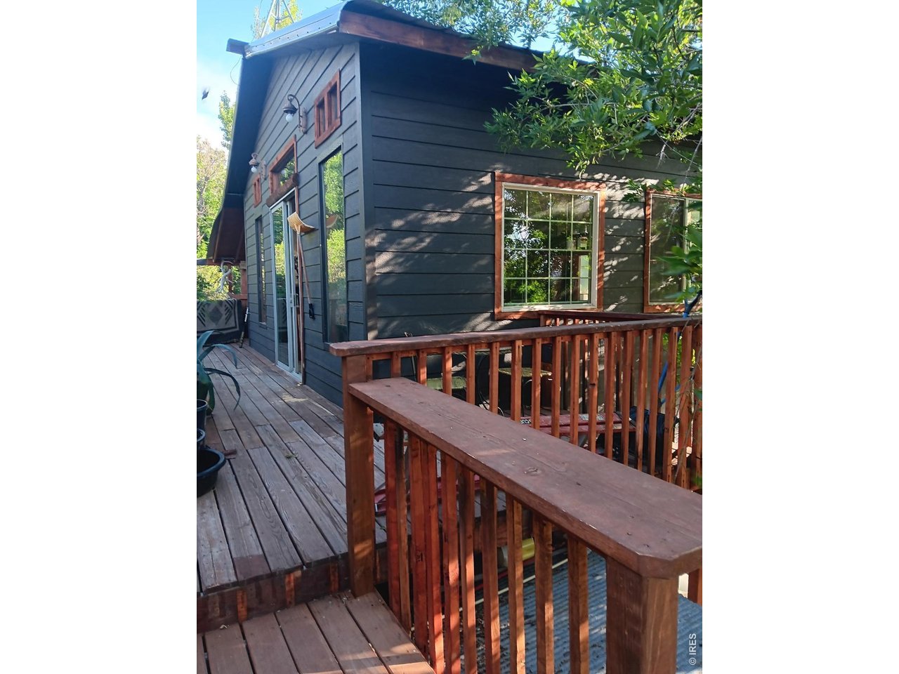 Rare and unique find near Horsetooth Reservoir! 3.13 sloping acres nestled in the trees, with beautiful rock outcroppings, and an intermittent spring that trickles into a pond. Main home is a ranch style with three bedrooms, 4 bathrooms, and a walkout lower level. Multiple decks for enjoying the outdoors, and occasional wildlife. Property also includes a detached accessory living unit. Accessory unit is permitted and also includes a kitchen, 3/4 bath, and tall ceilings for that large open feel. Former two car garage is now considered a basement, and provides ample storage, or could be converted back to oversized two car. Buyer to verify sqft. Listing Agent is related to Seller.