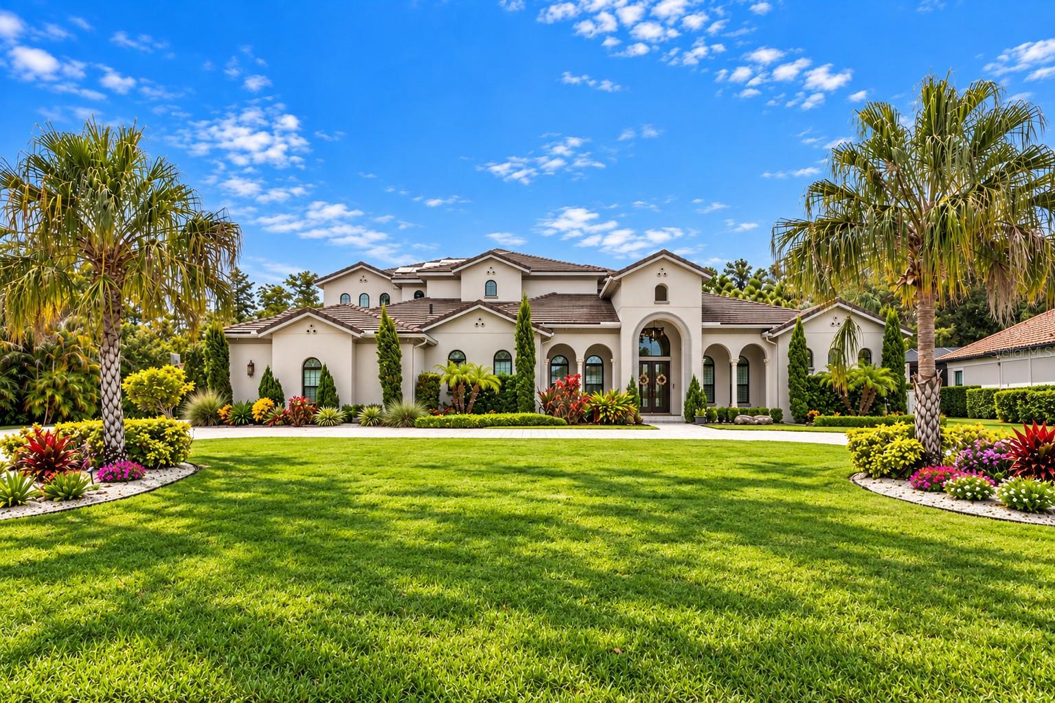 Virtually Staged. Move-in ready recent construction inside Avila Golf and Country Club, one of Tampa Bay's most coveted guard-gated communities.High ceilings, an oversized kitchen made for long dinners, and a first-floor primary suite with a bath that feels like your own wellness retreat.An elevator makes both levels effortless. Upstairs, a game room and movie room open onto an expansive balcony with staircase access to the backyard and the heated lap pool.Conservation views and nothing but peace and quiet. Full outdoor kitchen and nearly 2,000 square feet of covered and screened outdoor living that can be enjoyed almost year-round, plus a pool bath with sauna and steam shower.Fully fenced, with room to run and enjoy beautiful sunset colors.The house has been engineered for peace of mind with solar panels and three backup batteries, gas heat for the water and pool, spray foam insulation, impact windows and whole-home water filtration.The driving range is steps away, with club membership by separate application. Tampa International Airport 25 min, Veterans Expressway and top hospitals minutes away. Downtown Tampa 25 min. Clearwater and St. Pete 45 min.Privacy, wellness, and a home that's already finished. Recent construction with this combination of lifestyle and setting is rarely available. Buyers wait years for this in Avila.