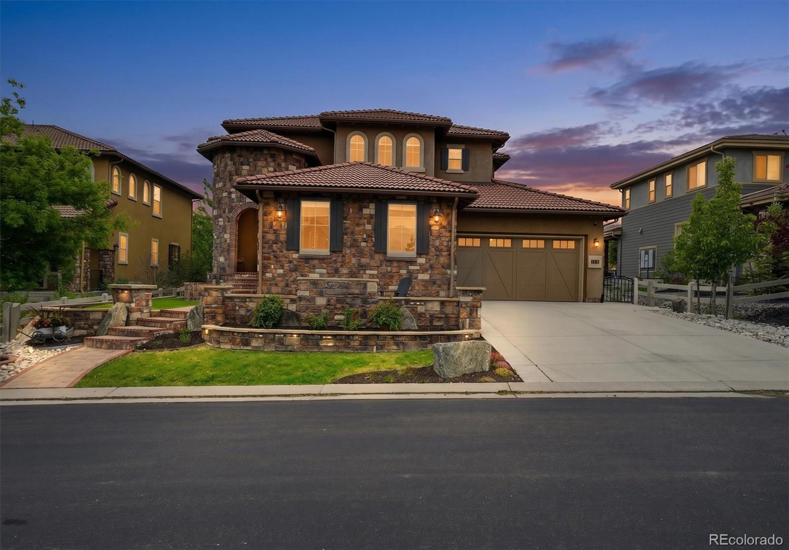 Experience elevated Colorado living in the former Shea Serenity Star custom home, conveniently positioned within the prestigious BackCountry community of Highlands Ranch. This luxury residence blends sophisticated design with resort-style amenities, creating an atmosphere that is both elegant and inviting. Inside, natural light pours through soaring vaulted ceilings, oversized picture windows, and expansive sliding glass doors that seamlessly connect indoor and outdoor living spaces. At the heart of the home, the chef’s kitchen impresses with quartz countertops, upgraded appliances, abundant storage, and a spacious butler’s pantry designed for effortless entertaining. Adjacent to the kitchen, the dining area is perfect for intimate dinners or large gatherings, while the dramatic great room showcases a floor-to-ceiling stone fireplace with designer-inspired ambiance. Step outside to your private outdoor oasis, designed for year-round enjoyment. The expansive covered patio features an outdoor kitchen, hot tub, and stone fireplace. The main level also includes a flexible office or formal dining space, private guest suite with ensuite bath, and thoughtfully designed mudroom/laundry room. The immaculate 3-bay garage has finished epoxy floors. Upstairs, the luxurious primary suite serves as a true retreat with its own gas fireplace, spa-inspired bathroom, and dual customized walk-in closets. Two additional ensuite bedrooms and an expansive loft provide comfort and versatility for family and guests alike. The finished basement is built for entertaining with a theater area, wet bar, expansive game space, additional guest suite, and a nicely appointed bath. As a resident of BackCountry, enjoy exclusive access to the renowned Sundial House, Lost Coffee, resort-style pool and fitness center, spa treatment rooms, private concerts and comedy events, plus miles of scenic private trails, parks, and tranquil ponds. This is more than a home — it’s a lifestyle reserved for the few.