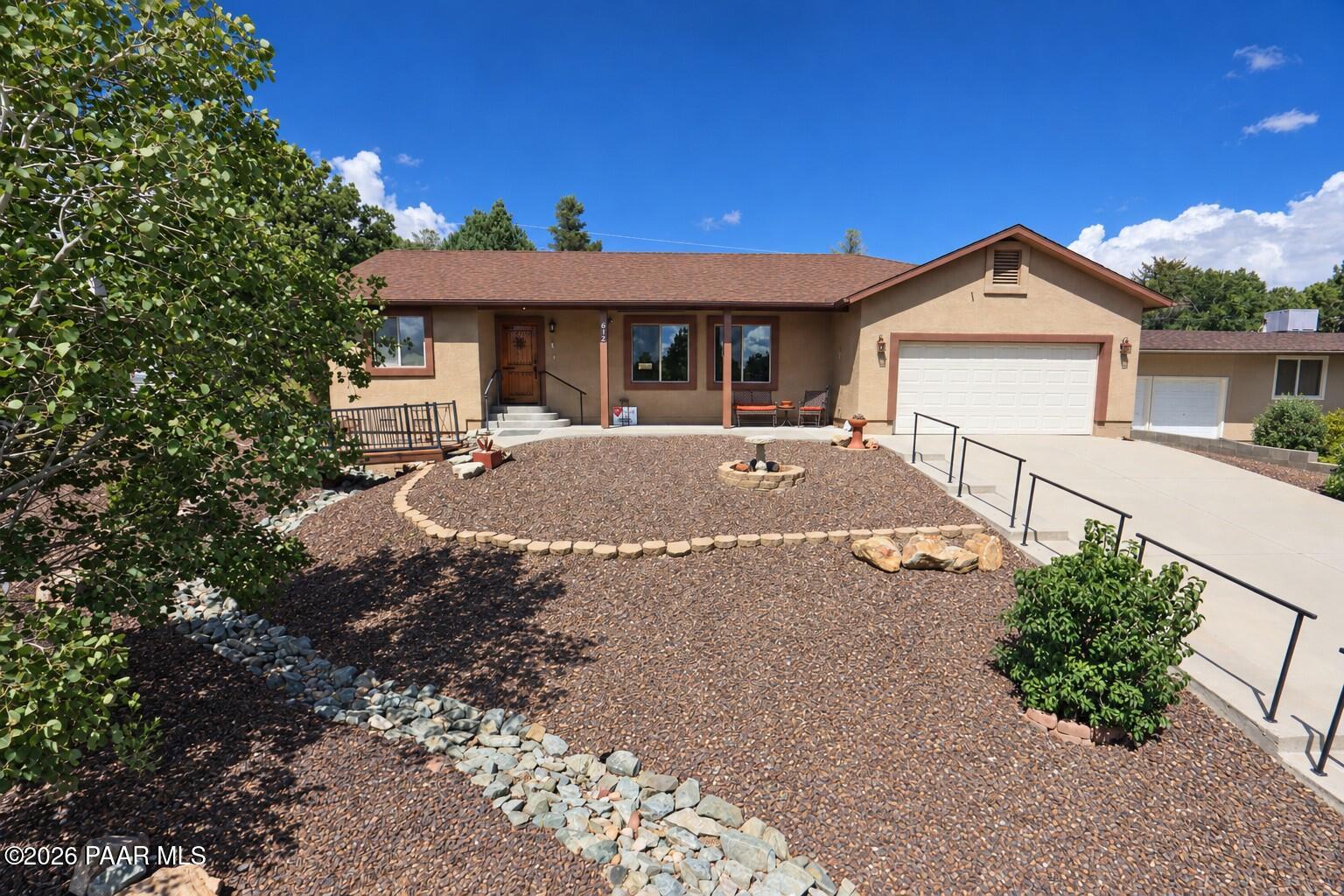 Truly unique Prescott home situated on an oversized lot of more than one-quarter acre, just minutes from downtown dining, shopping, and medical services.At the heart of the home is an impressive, light-filled great room where dramatic vaulted ceilings and abundant windows create an exceptional sense of openness. From here, enjoy views that include Prescott's iconic Thumb Butte. The adjoining kitchen features granite countertops, extensive cabinetry, a pantry, stainless-steel appliances, and generous workspace.This well-maintained three-bedroom, two-bath home offers cohesive wood-look flooring throughout the main living areas and bedrooms. The spacious owner's suite is further enhanced by its vaulted ceiling and includes a private bath and exceptionally generous walk-in closet.Outside, enjoy both front and rear outdoor living areas, including a large covered back patio ideal for entertaining or relaxing in Prescott's four-season climate. The oversized lot features low-maintenance high-desert landscaping, mature Aspens and shade trees, garden space, and two storage sheds.Additional highlights include a spacious two-car garage and dedicated RV parking along the side driveway with hookups.Conveniently located near Prescott High School and Taylor Hicks Elementary, this distinctive home combines space, views, storage, and an excellent central Prescott location. Don't miss this rare opportunity.