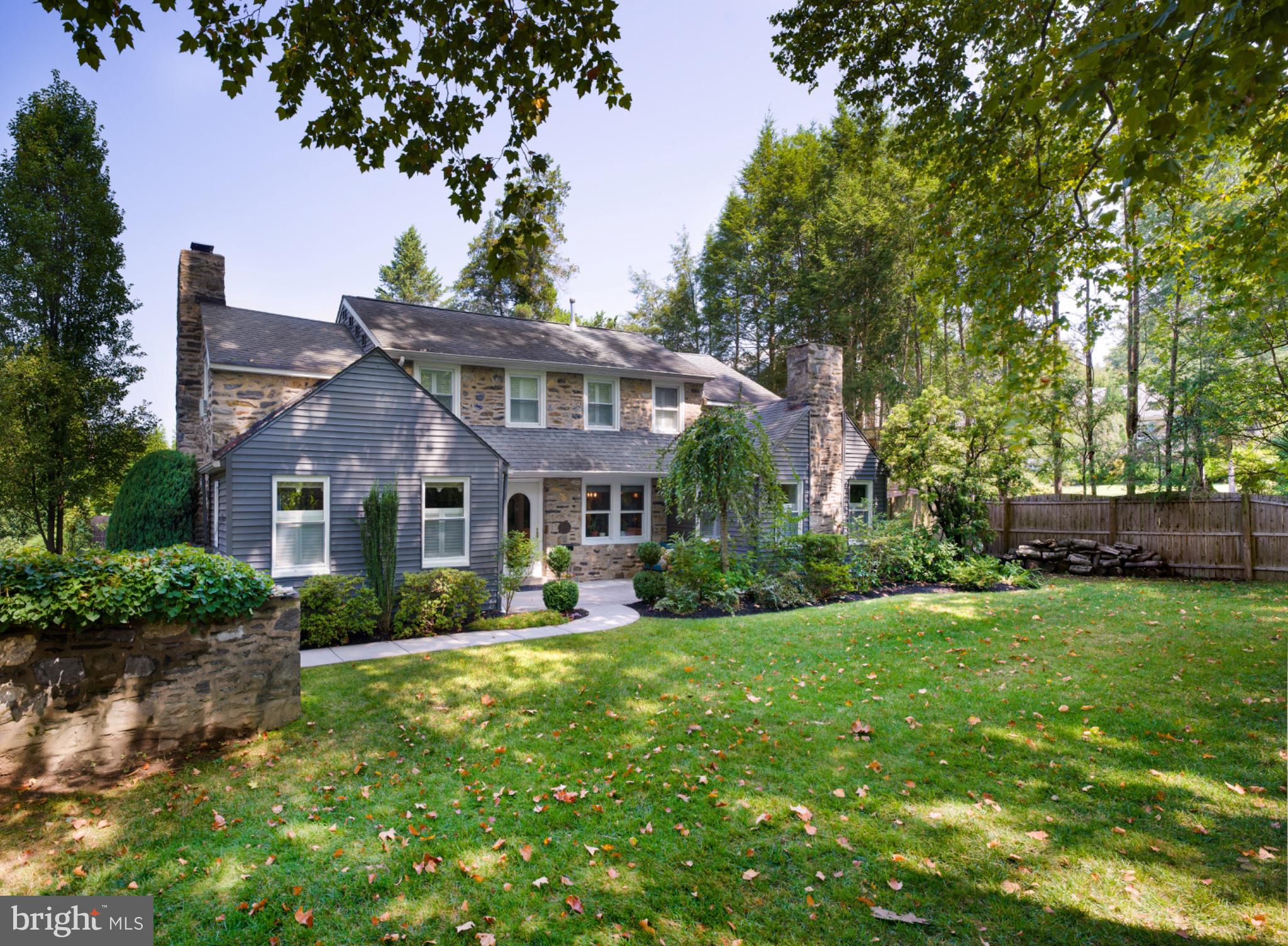Nestled in the charming Green Hill neighborhood, this delightful colonial home exudes warmth and timeless elegance. Built in 1929, it features a blend of classic stone and wood siding, adding to its timeless appeal. As you step inside, discover the rich wood flooring that flows throughout, bright and open living space, a cozy fireplace that serves as a focal point in the inviting living area and an amazing open and airy kitchen which will sure to be the center of attention as it will become the centerpiece for your daily life. With four spacious bedrooms including two ensuites, a hall bath, as well as a hall bath in the lower level, there is plenty of space for all. The partially finished basement provides additional space for recreation and storage. The outdoor oasis features a large pool with extended patio and outdoor shower area, with privacy on every side as well as a beautiful covered area for outdoor entertaining, a small pond, and mature plantings. Experience the ultimate in luxury living, where every detail has been thoughtfully curated for an exclusive lifestyle.