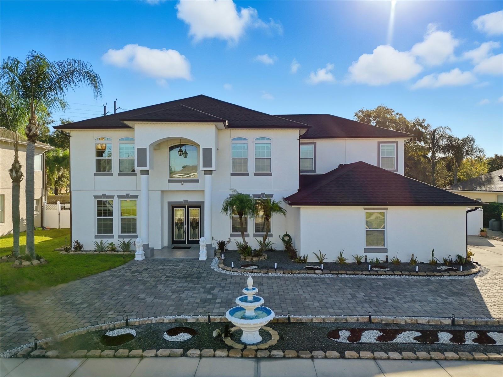 Under contract-accepting backup offers. Look no further than this stunning 5-bedroom, 3-bath home nestled in a gated community in Oviedo, FL. Custom rebuild in 2019, this exquisite residence combines modern luxury with comfort, offering 3,411 square feet of living space on a beautifully landscaped lot. This home welcomes you into an expansive foyer that leads to a formal living and dining area, opening up to a spacious open-concept living space. The kitchen is a chef's dream, featuring elegant granite countertops, a central island, ample overhead lighting, and premium stainless steel appliances, including an induction cooktop stove and a Samsung smart refrigerator. The seamless flow between the kitchen, dining, and family room creates the perfect environment for both entertaining and everyday living. This home boasts five spacious bedrooms and three luxurious bathrooms. Upstairs, the primary suite serves as a private retreat with a walk-in closet and a spa-inspired bathroom, complete with a Jacuzzi tub and a separate shower. One bedroom, conveniently located downstairs with a full bathroom, is ideal for guests or multi-generational living. Upstairs also features a generously sized loft that can serve as an office or extra living area. The outdoor space is perfect for entertaining. The large backyard features a huge patio, a charming gazebo for relaxing, and a dedicated barbecue area. Because the main foundation and pavers are already in place, a new owner can personalize the look without starting from scratch. The fully fenced yard offers privacy and added security, making it an ideal setting for various outdoor activities. DID I MENTION NO REAR NEIGHBORS?! Located close to UDF, this Seminole County gem is within a reasonable distance of Central Florida's best eateries, theme parks, and attractions. Offering both convenience and elegance, this home provides easy access to Orlando and Sanford airports, as expressway access is just minutes away. If you are looking for an exquisite home in a small neighborhood to make your very own, grow your family, or simply escape the snow for sunny Florida, this is an exceptional choice. Contact us today!