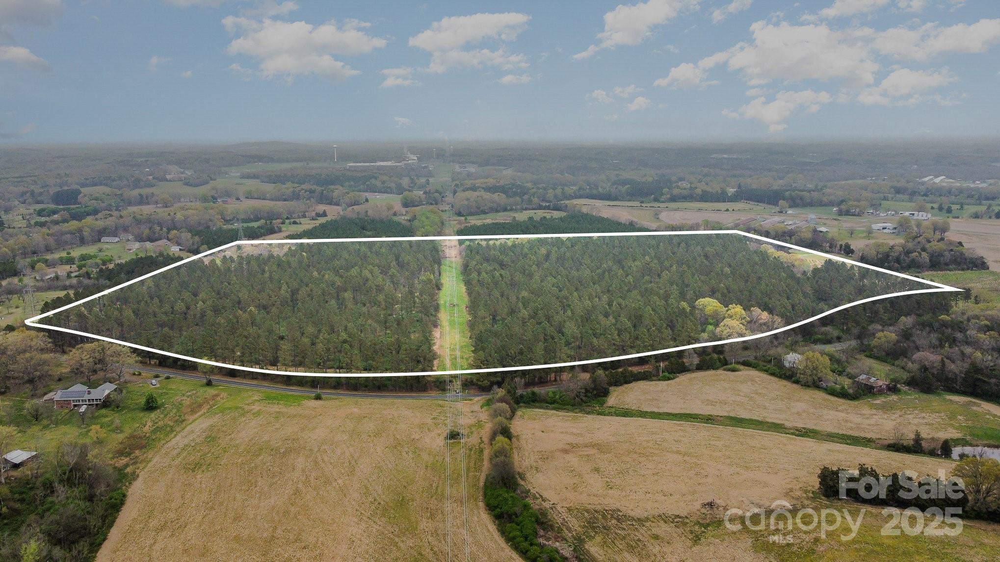 Located in the sought-after Oakboro area, this 67.10-acre property is a perfect canvas for your dream family homestead. Planted with mature pines and managed under the forestry program, the land offers a serene and well-maintained environment. Enjoy the tranquility of three small ponds scattered across the property, ideal for relaxation or wildlife viewing. With its prime location just a short drive from Locust, Albemarle, and Charlotte, you’ll experience the best of both peaceful country living and convenient access to nearby cities. Whether you're looking to build, invest, or simply escape, the possibilities are endless on this incredible property. Listing agent is related to the seller.