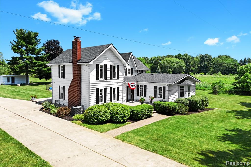 Welcome to this beautifully restored and lovingly maintained farmhouse, set on 4 picturesque acres in the sought-after Hartland School District. This warm and inviting home offers four spacious bedrooms and two and a half bathrooms, providing ample space for both everyday living and entertaining. Inside, you'll find a cozy family room with a wood-burning fireplace and a bright, airy living room with a gas fireplace—both perfect for gathering and relaxing.

The kitchen is a true centerpiece, featuring granite countertops, stylish fixtures, a generous breakfast nook, and easy access to a formal dining room that’s ideal for hosting friends and family. A large main floor laundry room, excellent closet space, and thoughtful built-in details and cubbies throughout add to the home’s functionality and charm. Sunlight pours into every room, highlighting the home's welcoming and cheerful atmosphere.

Step outside to enjoy your private outdoor oasis, complete with an in-ground pool that includes a slide, diving board, and secure fencing—ready for summer fun. The property also features a barn, a solid block building that can be used as a garage or workshop, and a convenient pool house. Whether you're looking for storage, work-from-home space, or room for hobbies, this property has it all.

With no HOA, no dirt roads, and a peaceful setting that includes several fruit trees—apple, peach, and pear—this home offers the best of rural living with modern comforts. Don’t miss your opportunity to experience the lifestyle this exceptional farmhouse has to offer.

Join us for the OPEN HOUSE on Saturday, July 12 and Sunday, July 13 from 11:00 AM to 2:00 PM. Welcome home!