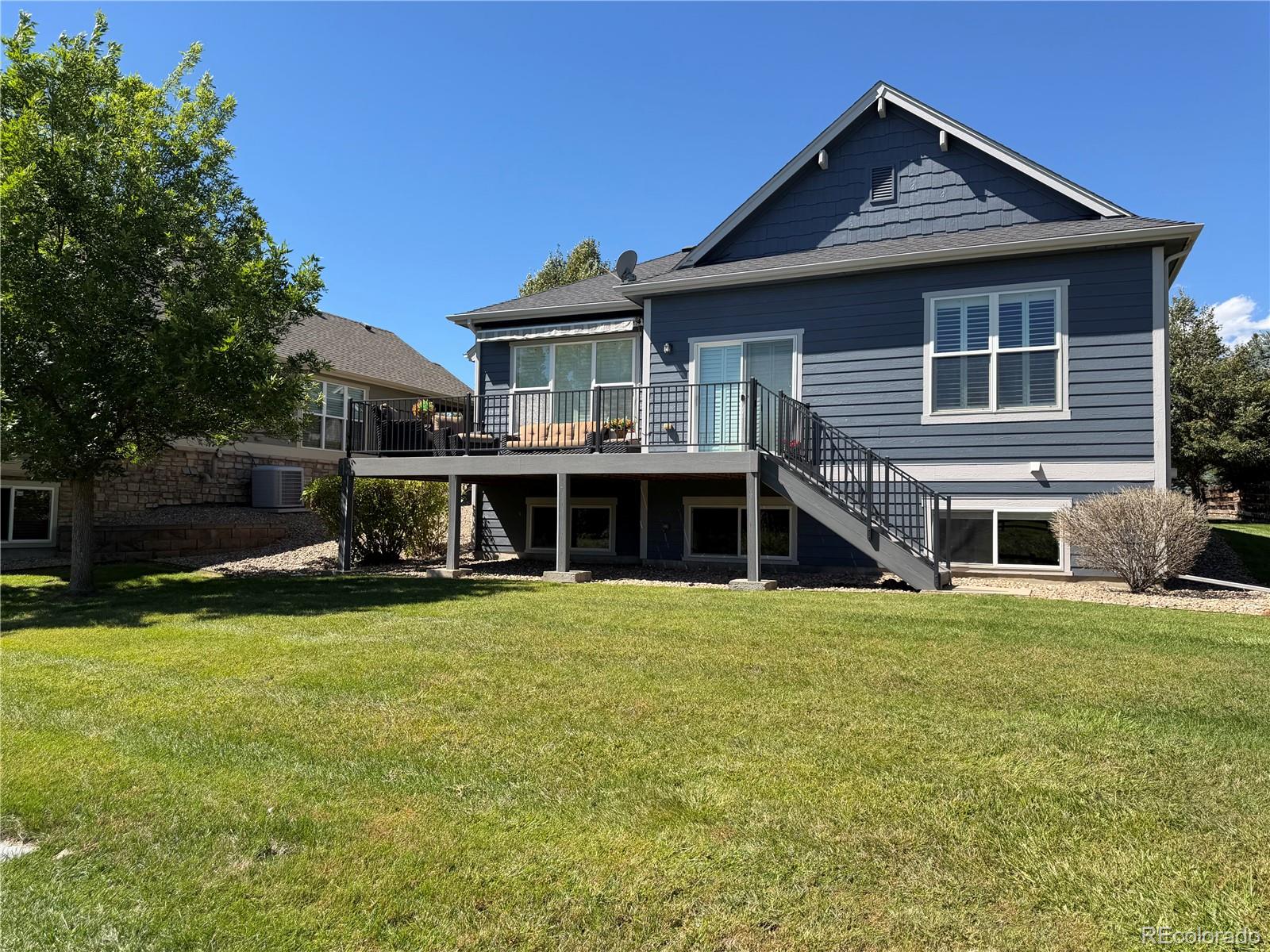 Professional photos coming on 9/10/26!One of the most coveted lots in Saddle Brook! This ranch style patio home is tucked back in a private area of the community on a quiet cul-de-sac, offering a rare blend of expansive outdoor space and true privacy. The 23' x 13' Trex deck—with power retractable awning—overlooks peaceful, serene views of the expansive, HOA-maintained grassy area, mature trees, and natural landscaping along the Farmer's Highline Canal.Inside, the spacious gourmet kitchen impresses with abundant cabinetry, granite countertops, stainless appliances, and double ovens, and opens directly to the deck. Both the kitchen and living room enjoy those same peaceful views, and the living room features a cozy gas fireplace. The main-level "bonus" room, adjacent to the living room, is perfect as a second dining space, home office, or reading room.The main level features a mix of beautiful hardwood floors and newer carpet, complemented by fresh paint throughout nearly the entire main level. Plantation shutters add a sophisticated touch.The primary suite boasts high ceilings, double closets, and a luxurious 5-piece en suite bath. A second main-floor bedroom and full bath provide flexibility. The main floor laundry includes built-in cabinetry with washer and dryer included.The garden level basement feels open and bright, with a spacious recreation room, third bedroom, and full bath—ideal for entertaining, guests, or multi-generational living.Enjoy low-maintenance living at its best, with lawn care and snow removal included! Located close to walking and biking trails, Saddle Brook Park, Ralston Creek Trail, Apex Rec Center, Colorado Tap House, West Woods Golf Course, and Arvada Indoor Equestrian Center. Don't miss this sought-after West Arvada gem!
