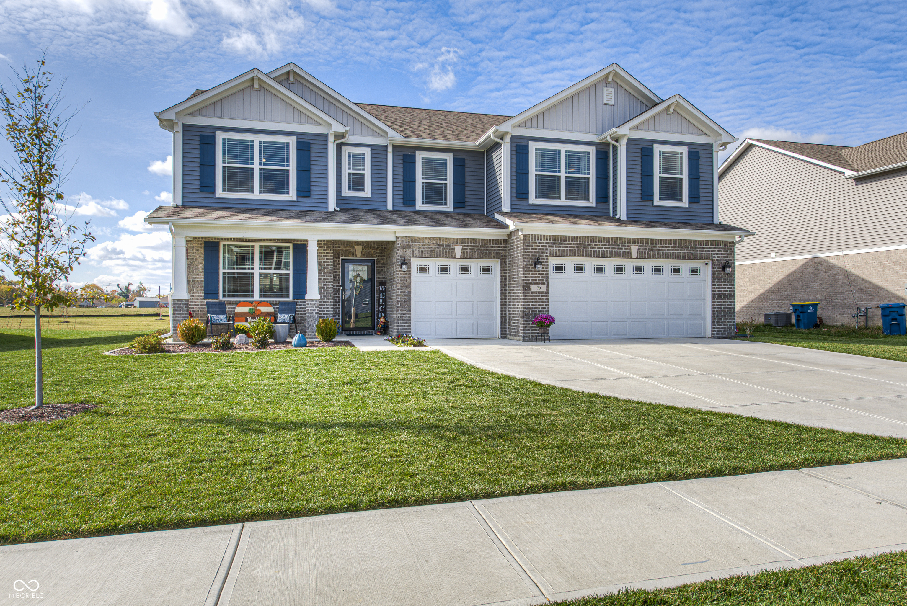 Step into style and comfort with this beautifully maintained home that truly shows like a model. From the moment you enter, you'll appreciate the thoughtful design and modern finishes throughout. The main level features new luxury vinyl plank flooring, offering both durability and a clean, updated look. The spacious kitchen is a standout, complete with quartz countertops, abundant cabinet and counter space, stainless steel appliances, and the perfect area for a coffee bar or additional prep space. The open layout flows seamlessly, making it ideal for both entertaining and everyday living.  The main level offers exceptional flexibility with both a bedroom and a separate office or additional living space, along with a full bath-perfect for guests, multi-generational living, or working from home. Upstairs, you'll find four generously sized bedrooms along with a versatile loft space, ideal for a second living area, playroom, or workspace. The primary suite is designed for comfort, featuring two walk-in closets and a spacious en-suite bath with dual vanities and a large glass-enclosed walk-in shower. This home includes numerous updates such as a custom front door and storm door, new shutters, updated lighting in the primary and lower bathrooms and over the kitchen island, five new ceiling fans, custom blinds throughout, fresh paint on the main level, and updated hardware in the kitchen and bathrooms. Situated on a desirable pond lot, this home offers peaceful water views and a relaxing outdoor setting. The three-car attached garage provides ample space for vehicles, storage, or hobbies. Enjoy the added community amenities, including a nearby playground and a scenic pond with a lighted fountain in the warmer months that is stocked for added enjoyment. This newer home offers all the benefits of modern construction without the wait. Move-in ready and meticulously cared for, it's an exceptional opportunity for buyers seeking space, functionality, and style.