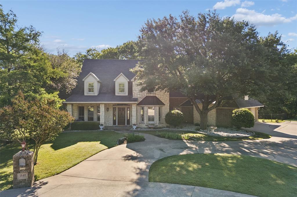 STUNNING LOT IN COVETED OAKWOOD ESTATES... Lovejoy ISD. Priced under all comparable sales. Lovely family home nestled on a heavily treed lot at the end of a peaceful cul-de-sac! This traditional home blends elegance, warmth, exceptional entertaining space, & offers 4 bedrooms, 6 bathrooms, and 5258 sq. For buyers needing 5 bedrooms, the second bonus space upstairs could be a great guest room option and is proximate to one of the 3 upstairs bathrooms. Our favorite features include the totally renovated primary bathroom with separate closets and water closets, hardwood floors, sunk-in family room with extensive beams, pocket doors, spacious secondary bedrooms, 4 car garage, and the private, lush backyard.  This lot is perfect as it sits adjacent to 2 greenbelts, and is within walking distance to the community park. Oakwood Estates is a magical neighborhood and feeds into the highly acclaimed Lovejoy ISD. Location is within minutes of all major highways, extensive retail, and popular restaurants. Home is now vacant and shows larger without furniture!