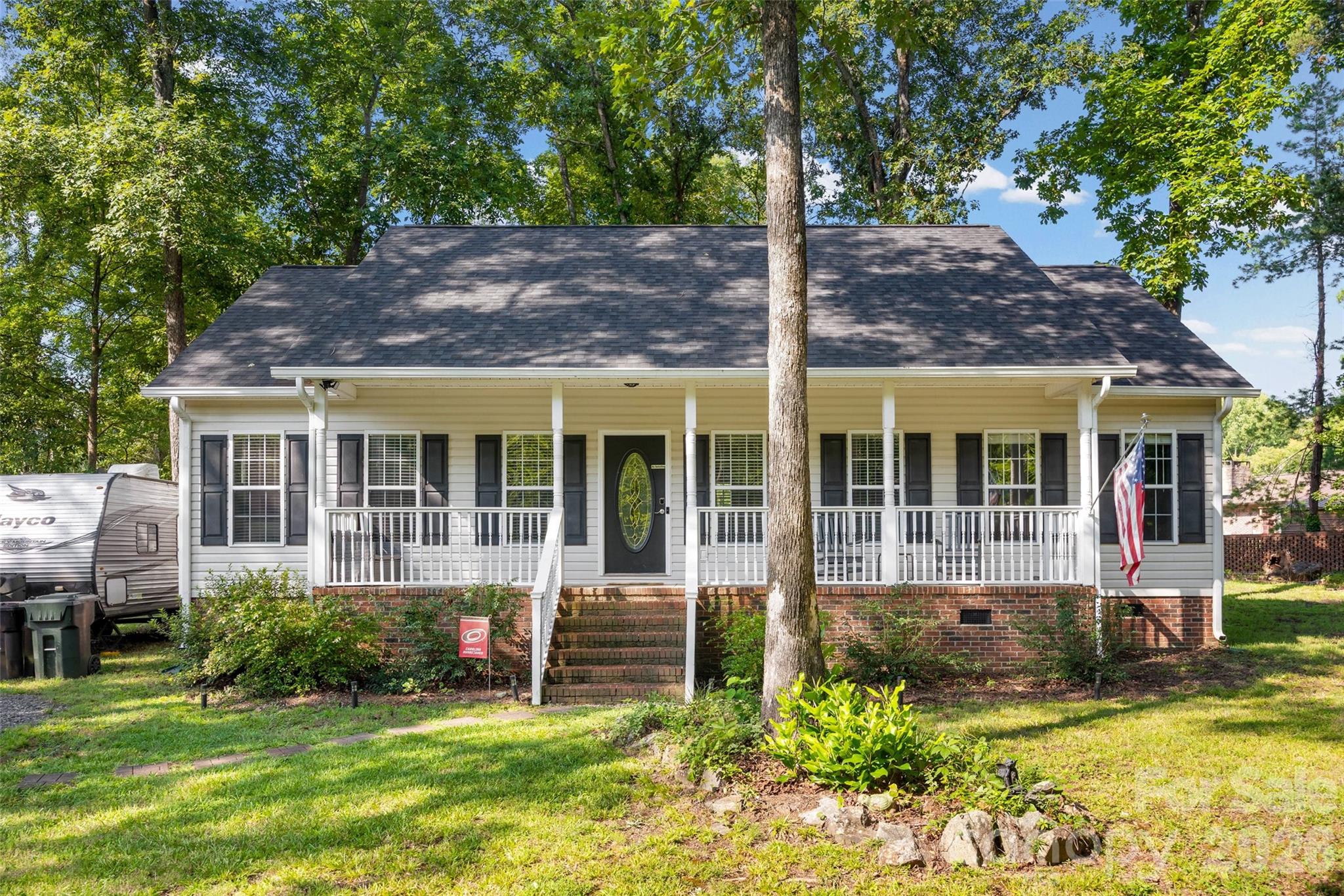 Nestled in the desirable Rock Hill Country Club Estates neighborhood just minutes from I-77, this charming ranch home offers the perfect blend of comfort, convenience, and privacy. Relax on the welcoming front porch or unwind on the freshly sanded and stained back deck overlooking a private, wooded backyard. Inside, you'll find fresh interior paint, granite countertops in both the kitchen and primary bath, and a functional layout designed for easy everyday living. Recent improvements include a new roof (2024) and a newly added storage shed to enhance the outdoor space while maintaining its peaceful wooded setting. Enjoy easy access to I-77, historic Downtown Rock Hill, shopping, dining, parks, and Winthrop University.