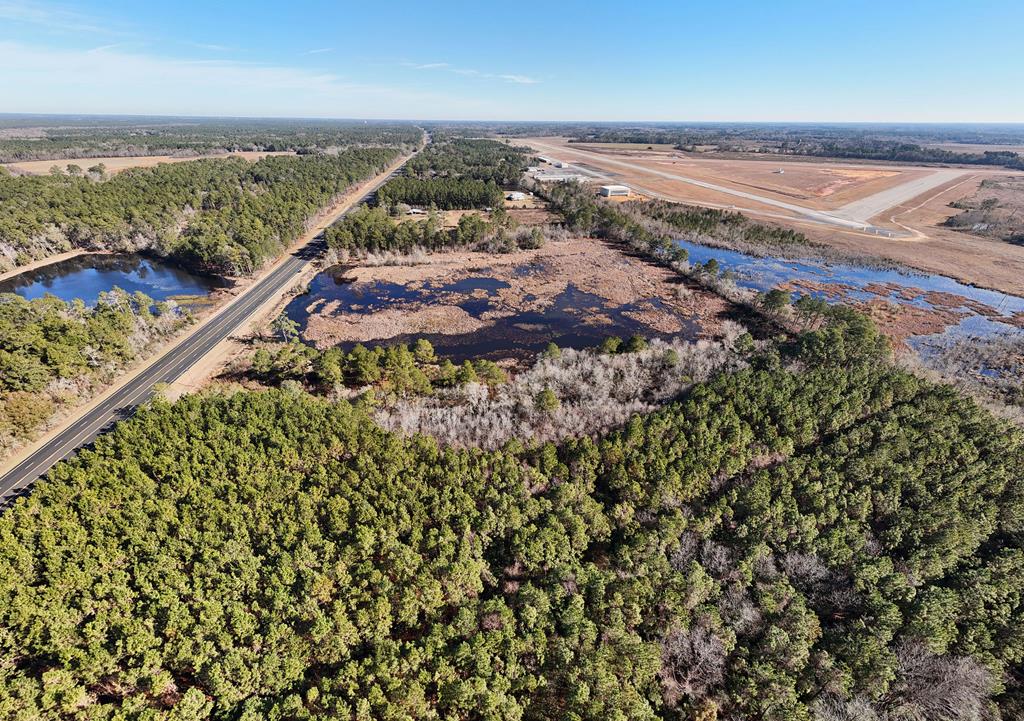 Discover space and privacy with this 23.22-acre property with a pond, conveniently located between Thomasville and Moultrie. With approximately 5 acres of buildable land, you'll have plenty of space in a country setting that is convenient to city access to design your ideal homestead or multiple home sites; the options are yours to create.