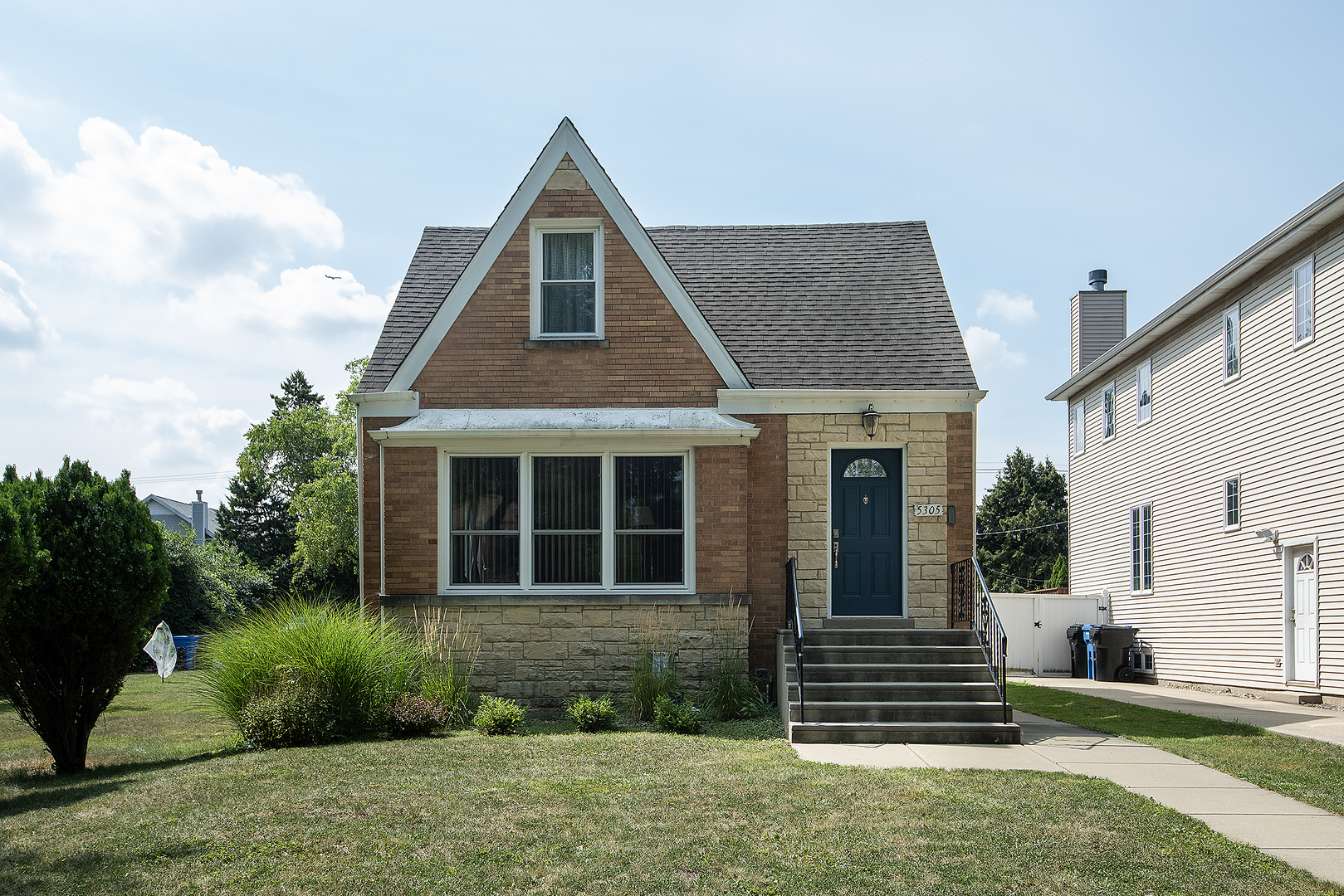 This delightful brick two-story great curb appeal home with Huge secluded lot. 3 bedrooms situated in the desirable Indian Woods location with close proximity to the forest preserve and the Beautiful North Branch trails. Tons of street parking! The main floor offers two bedrooms a spacious living room, dining room with hardwood floors, newer windows 2018. Kitchen with table area overlooking the large backyard and deck. Second floor spacious rooms, features large front loft room with hardwood floors, bathroom and kitchen. Full unfinished basement with storage and laundry room. Roof is approximately 15 years old.  Property being sold as-is.