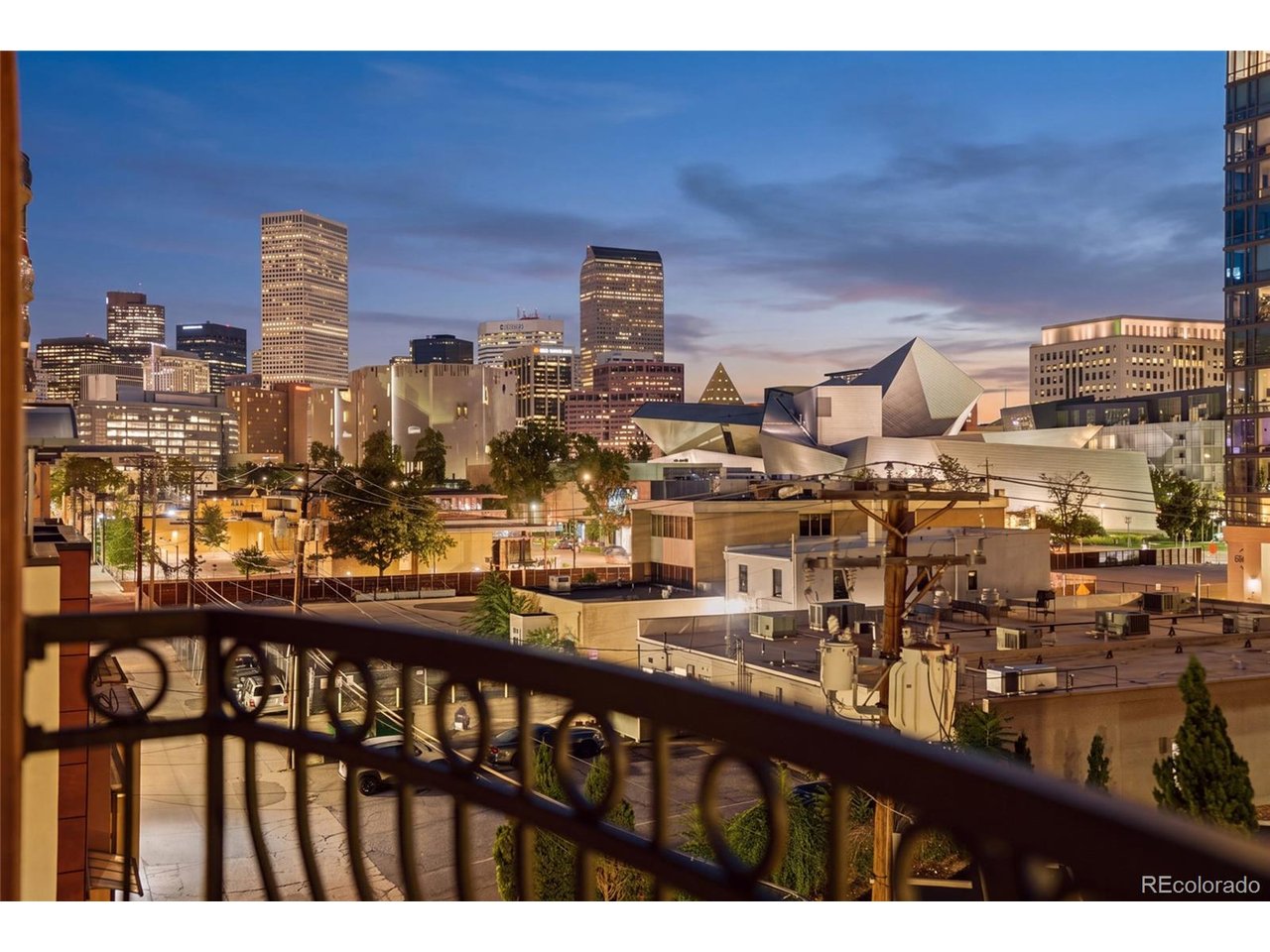 Located in the heart of the Denver Art Museum Cultural District and steps from Civic CenterPark and Capitol Hill, this spacious, light-filled oasis overlooks one of downtown's moststunning cityscapes. Exceptional dining, craft bars, shopping and entertainment are mereminutes away, as the Golden Triangle neighborhood is situated in close proximity todowntown Denver, RiNo and Cherry Creek.Welcome home to this exceptional 5th-floor residence at the Trieste, whose open floorplan, which is one of the largest single-floor square footages available in downtownDenver, demonstrates why this is such a sought-after mid-rise community. This 2-bedroom,2-bathroom condominium spans 1,665 square feet and has been updated throughout withMid Century Modern (MCM)-inspired elements that blend seamlessly with the building'sNeoclassical exterior.An integrated high-end A/V system, highlighted by a hidden 65-inch OLED TV that retractsinto the wall, is included. Combined with powered blinds that open to reveal stunningcityscapes, a custom 2-sided, remote-controlled fireplace, and anchored by a massive kitchenwith LED-lit, custom display shelving, premium natural quartz countertops and stainlessappliances and you have the perfect forum for entertaining as well as cossetted daily living.The primary suite includes a spacious walk-in closet and en-suite bath. The property includestwo deeded underground parking spaces, a prized amenity in this vibrant urban location. TheTrieste provides secure building access, elevator service, lush landscaping and awesomeviews from the residents' roof deck, all within a well-maintained 1998 building. Revel in thevery best of urban living in the heart of the Mile High City.